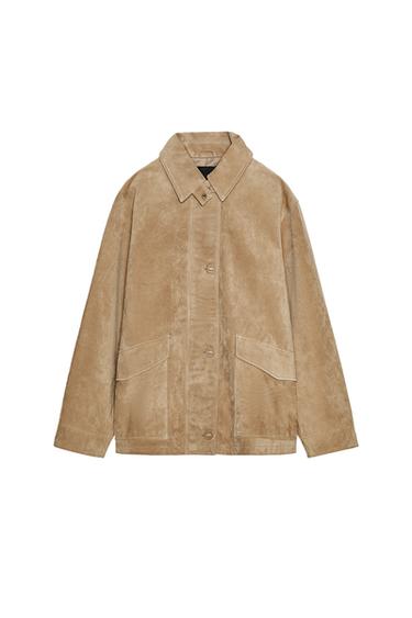Front view of a light sand jacket with a shirt collar, long sleeves, button fastening and front flap pockets.