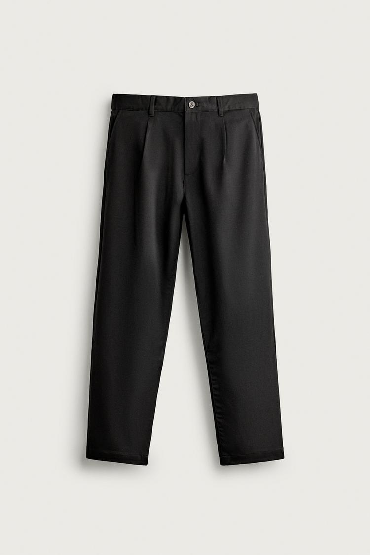 RELAXED FIT PLEATED TROUSERS