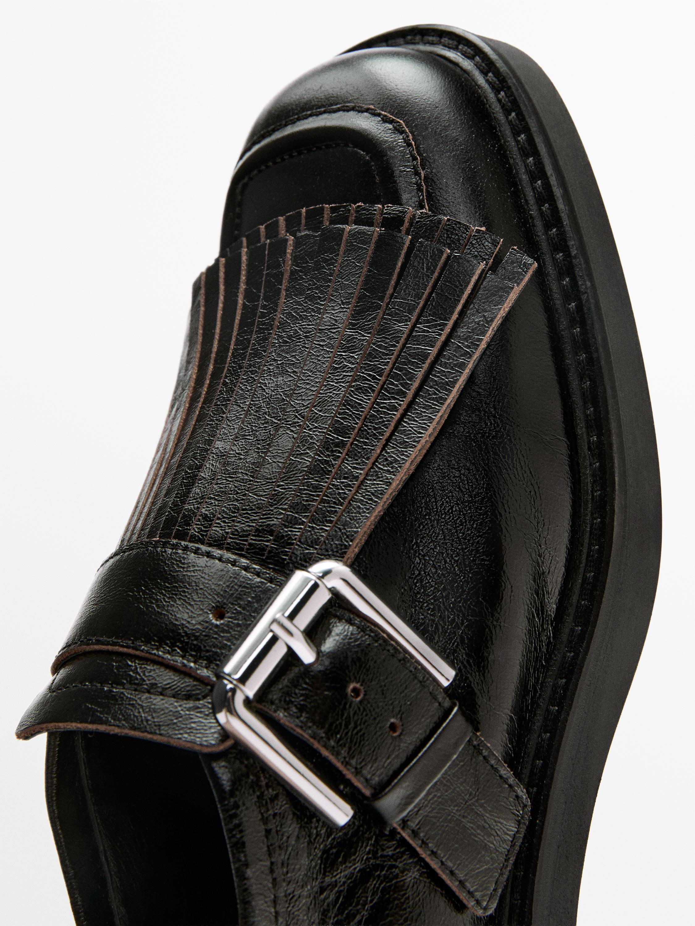 Buckled derby shoes with fringe