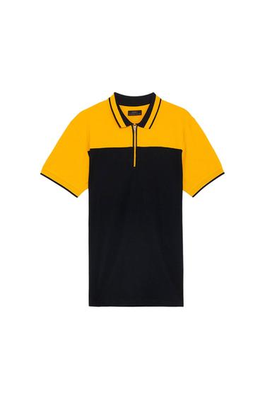 Front view of a yellow and black polo shirt with a short zip.