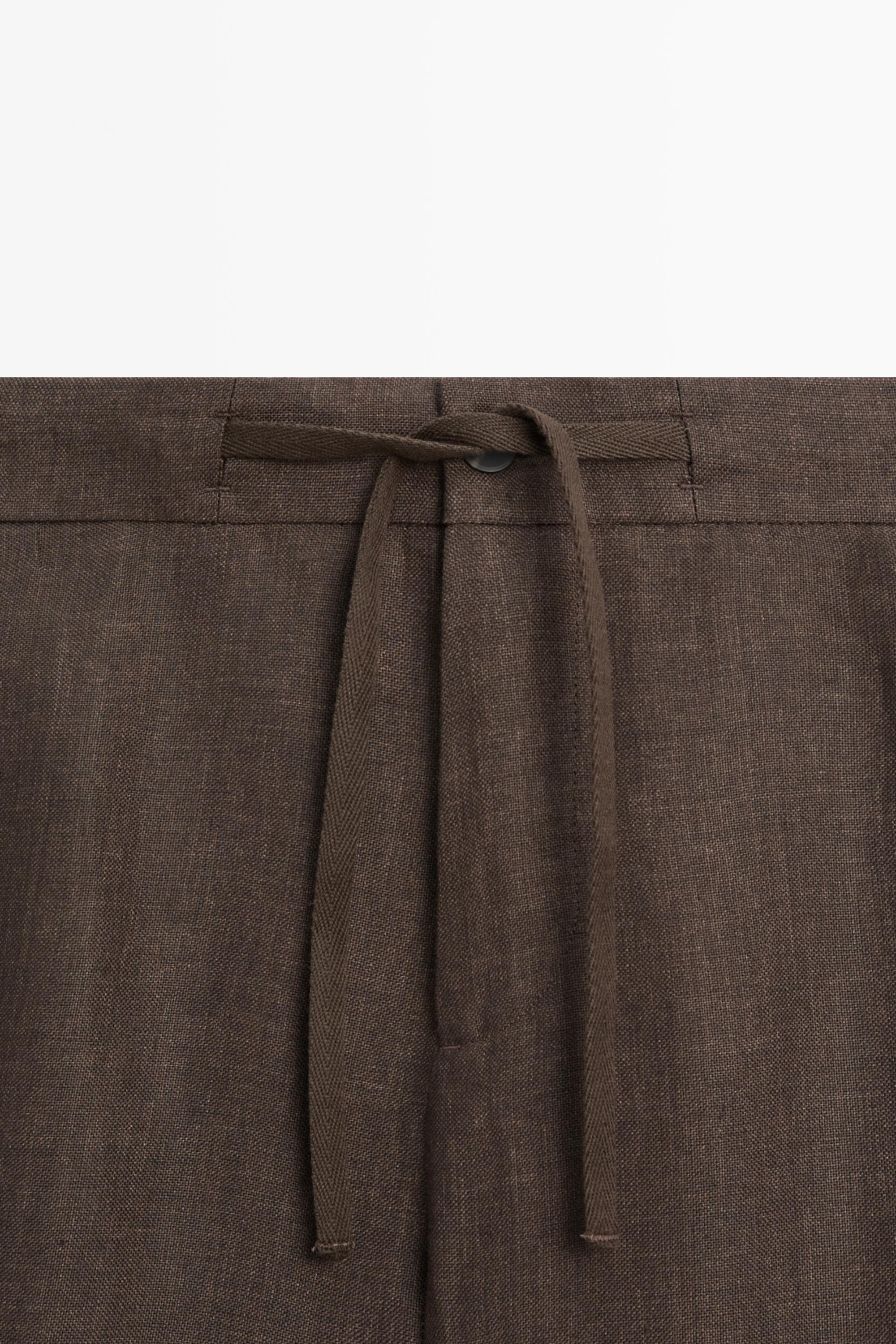 Faded total look linen trousers