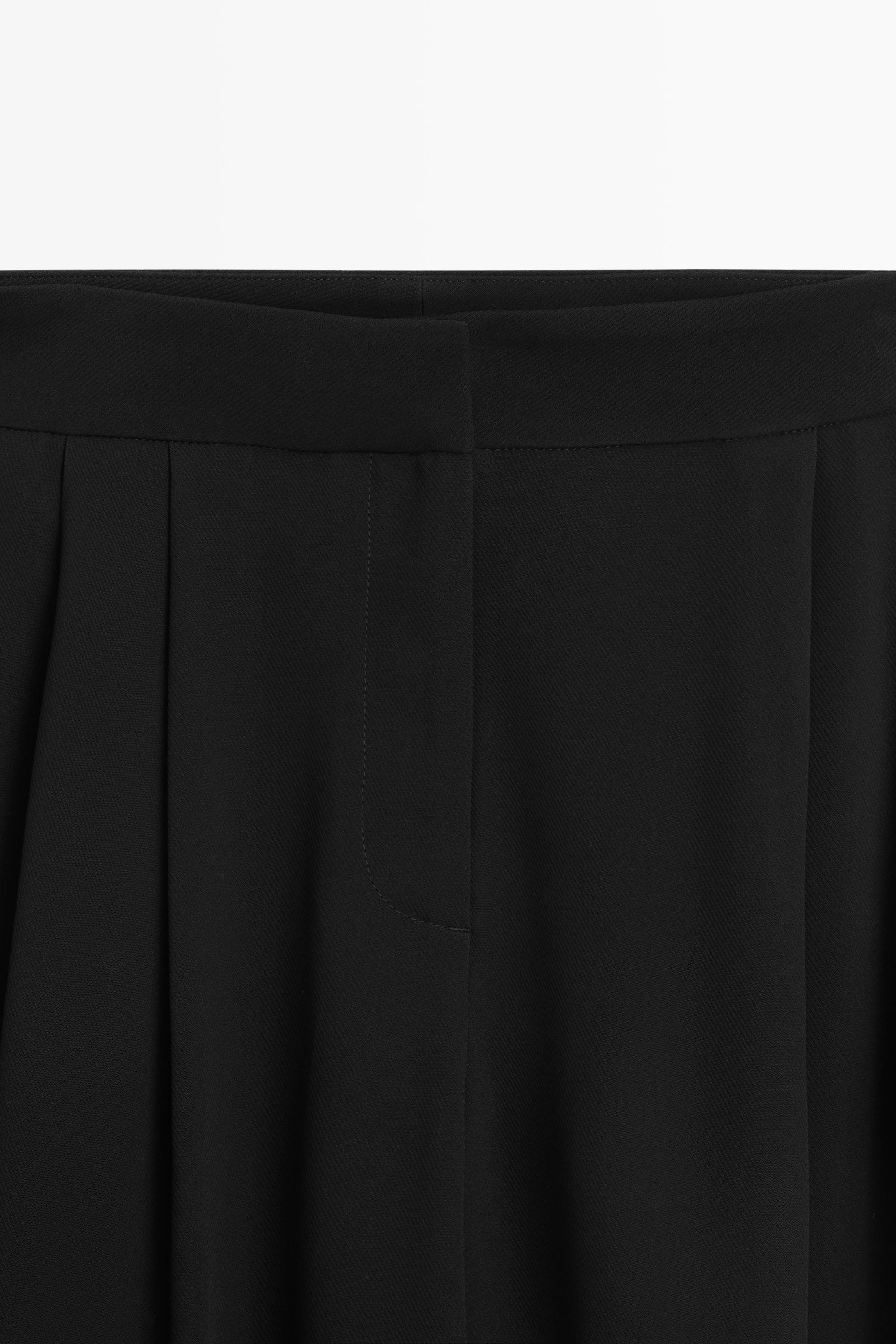 Pantalon large à plis