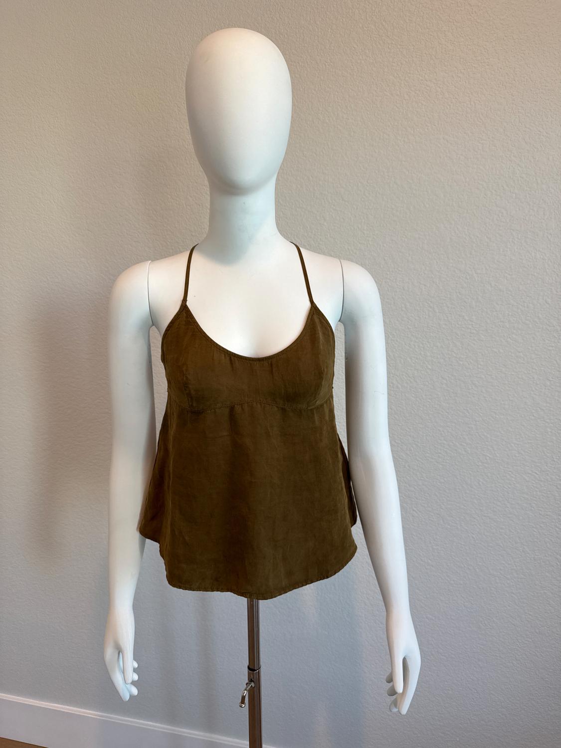 White mannequin wearing a brown camisole with thin straps and a round neckline in front of a light-colored wall.