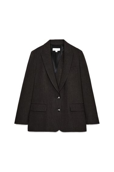 Front view of a brown blazer with lapel, shoulder pads, front flap pockets, and two-button fastening.