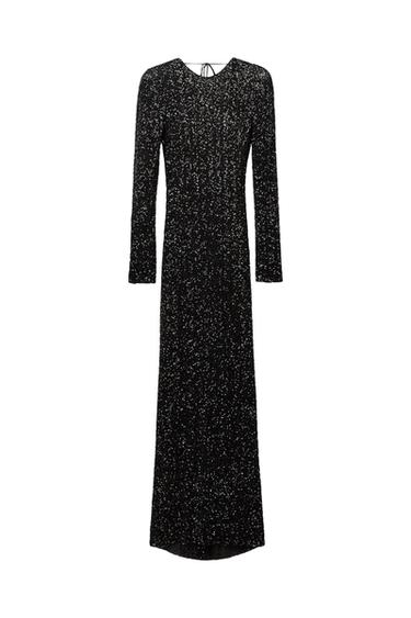 Front view of a long black dress with sparkle and long sleeves.