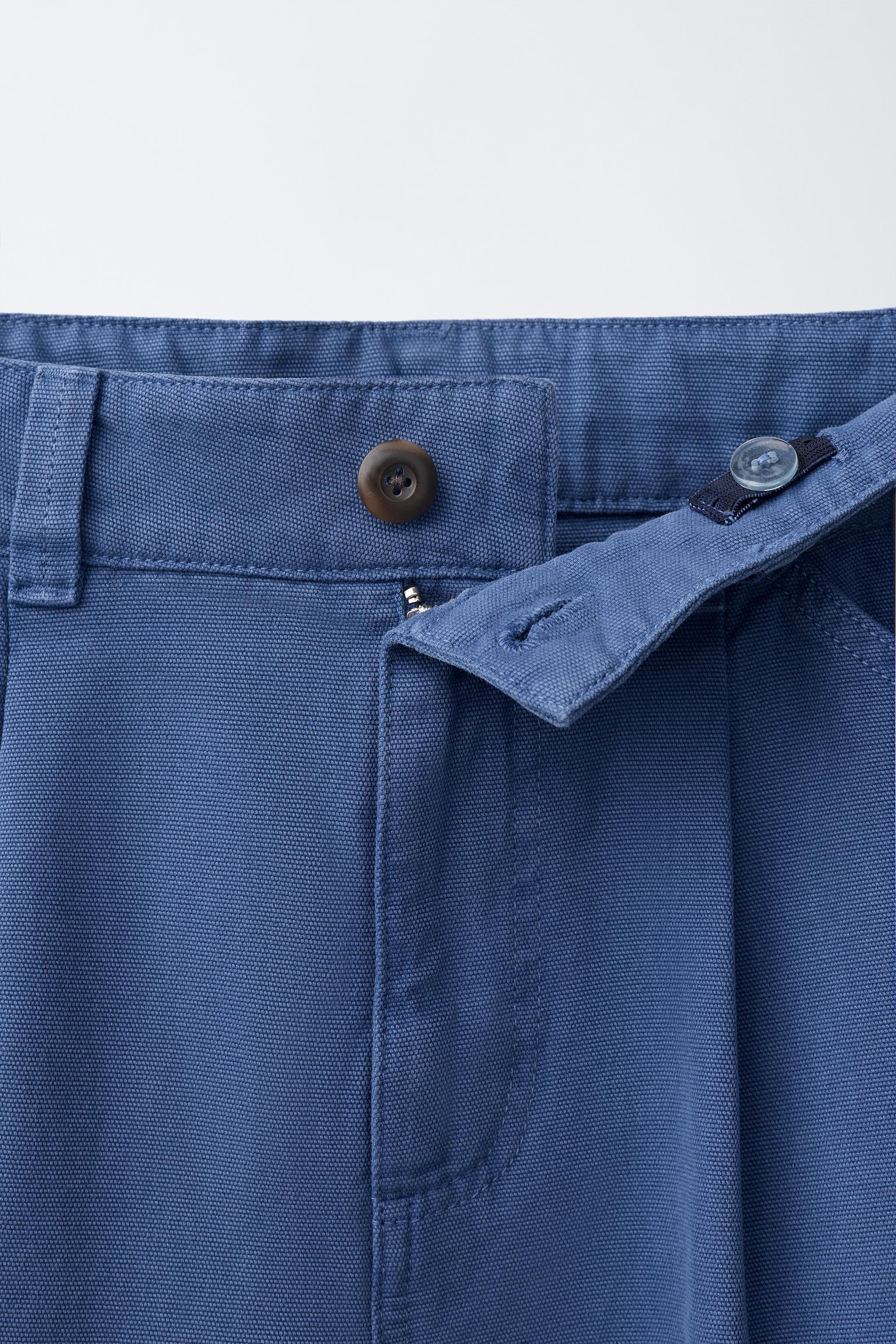 DISTRESSED WIDE-LEG PANTS