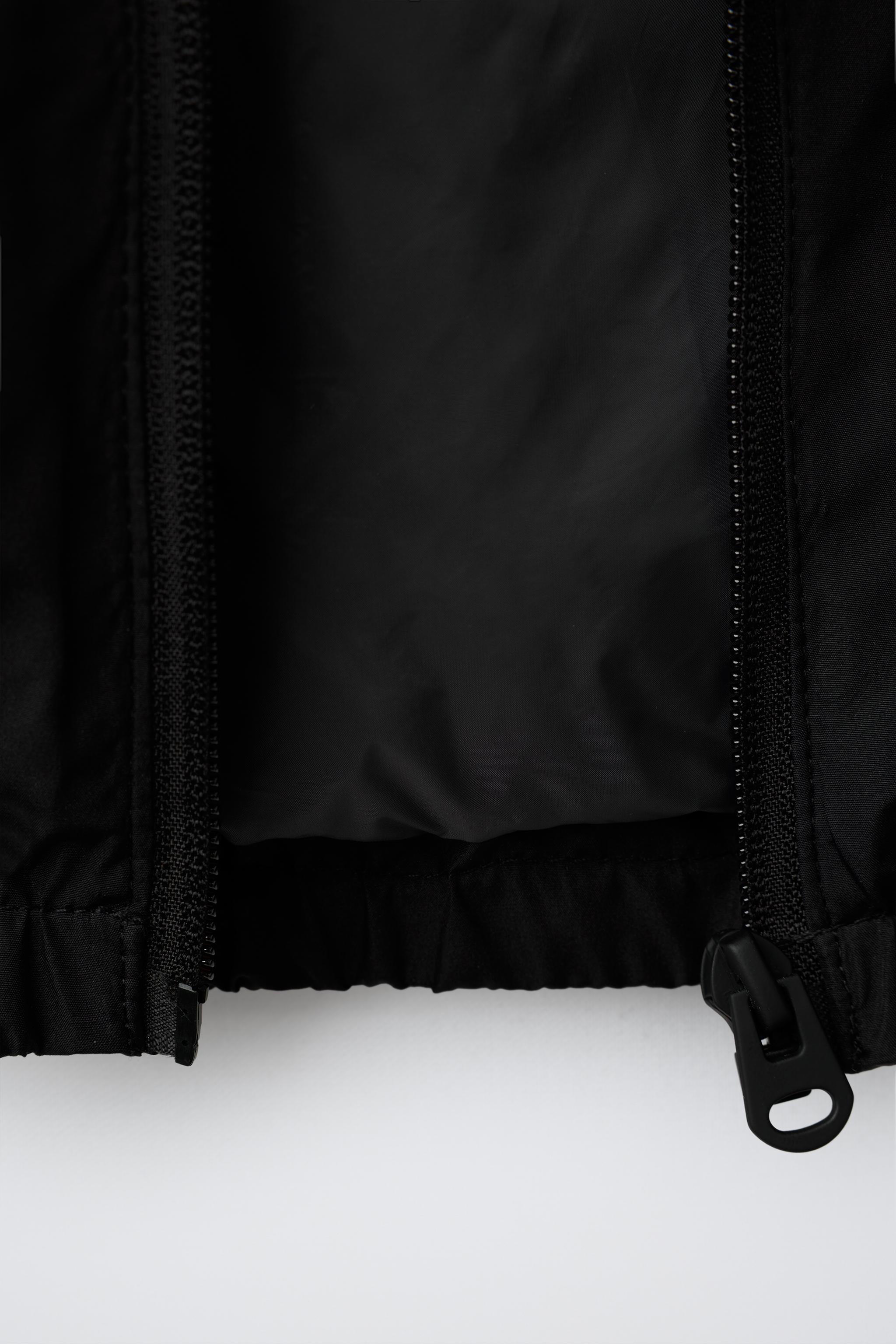 WATER REPELLENT TECHNICAL RAINCOAT