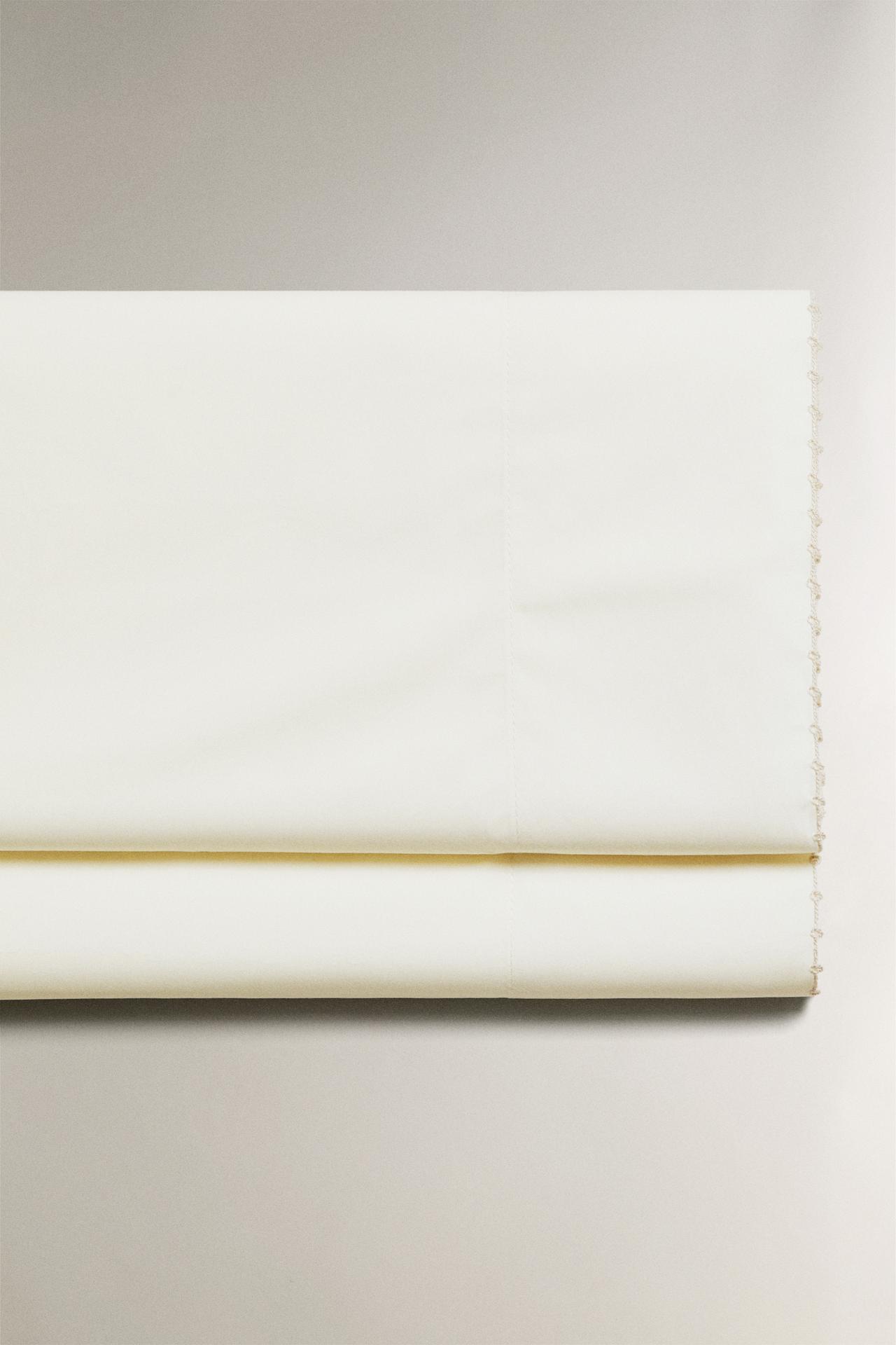 FLAT SHEET WITH EMBROIDERED TRIM — Oyster-white