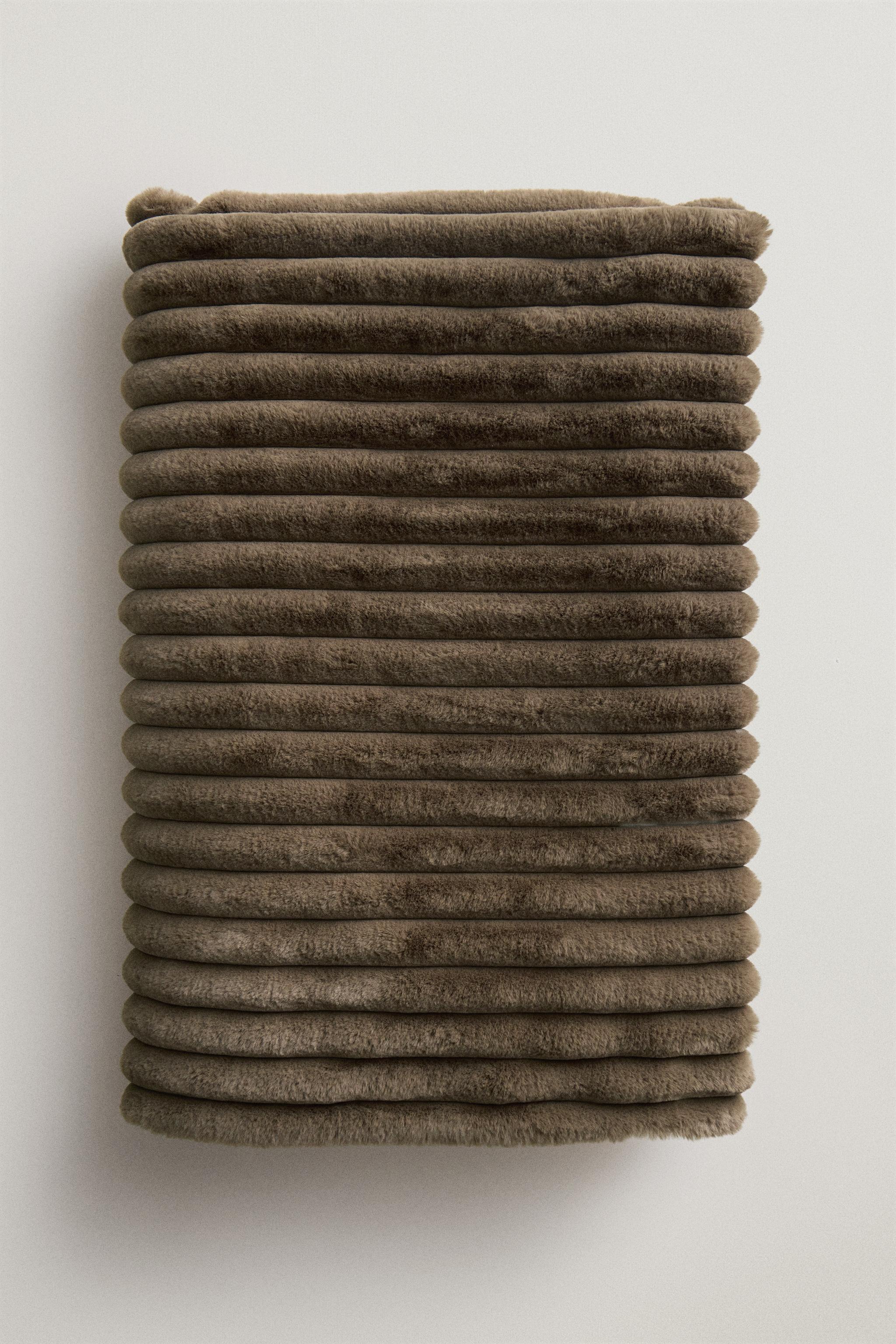 TUBULAR EMBOSSED FUR BLANKET