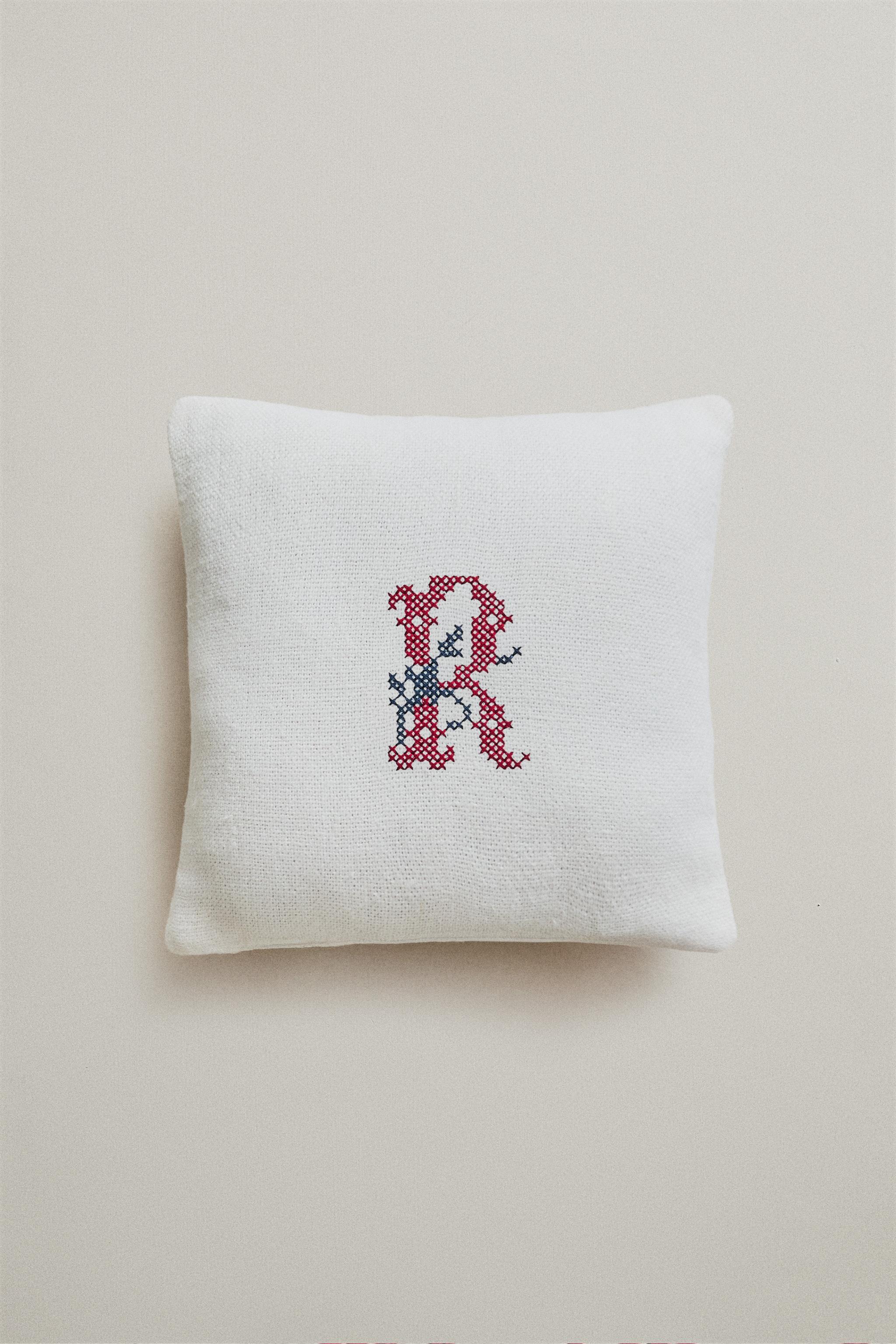 “R” EMBROIDERED LINEN CUSHION — Ecru