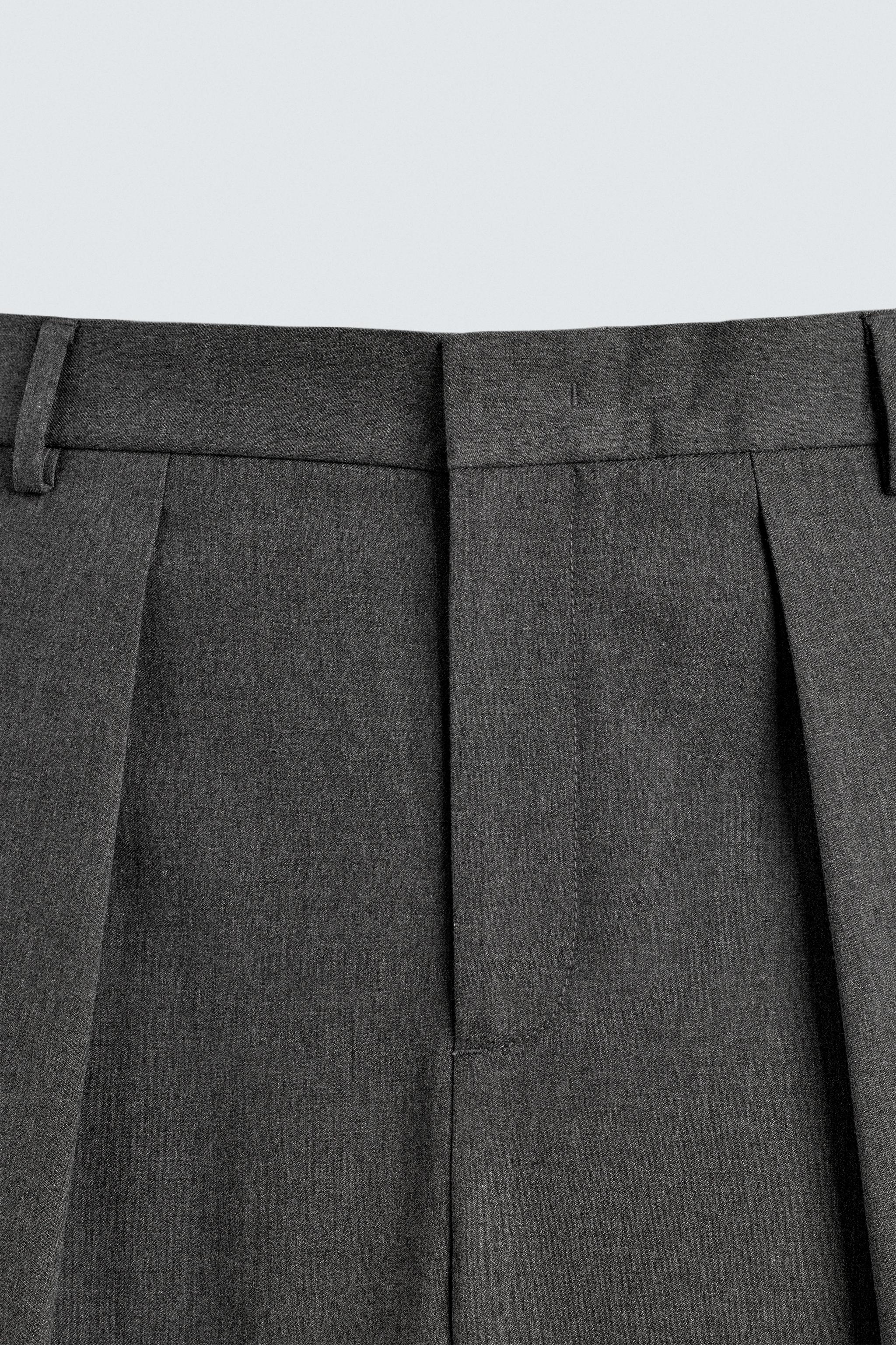 PANTALON À PLIS RAYURES