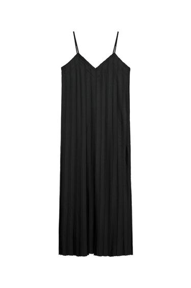 Front view of pleated black dress with spaghetti straps.