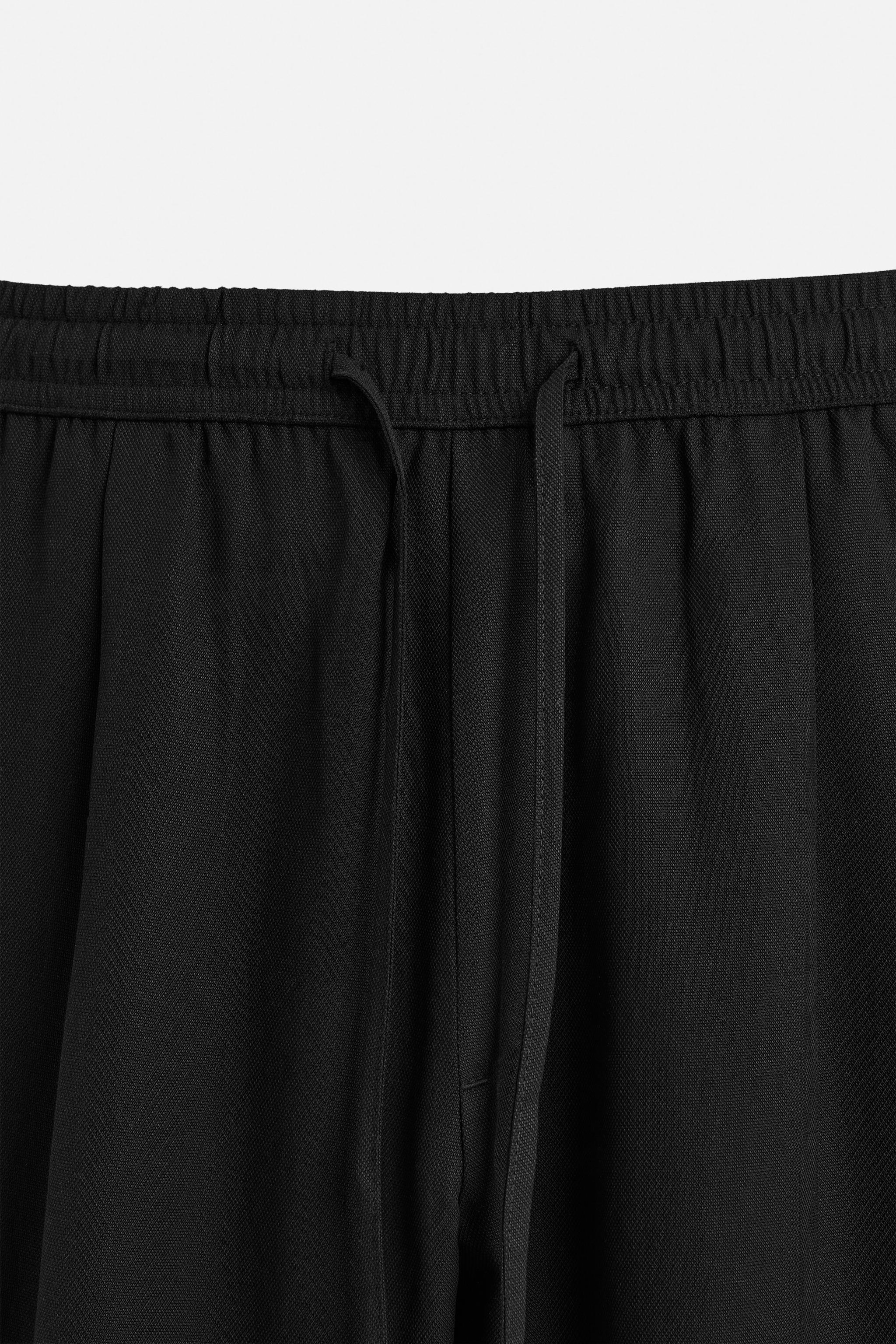 RELAXED FIT FLOWY PANTS