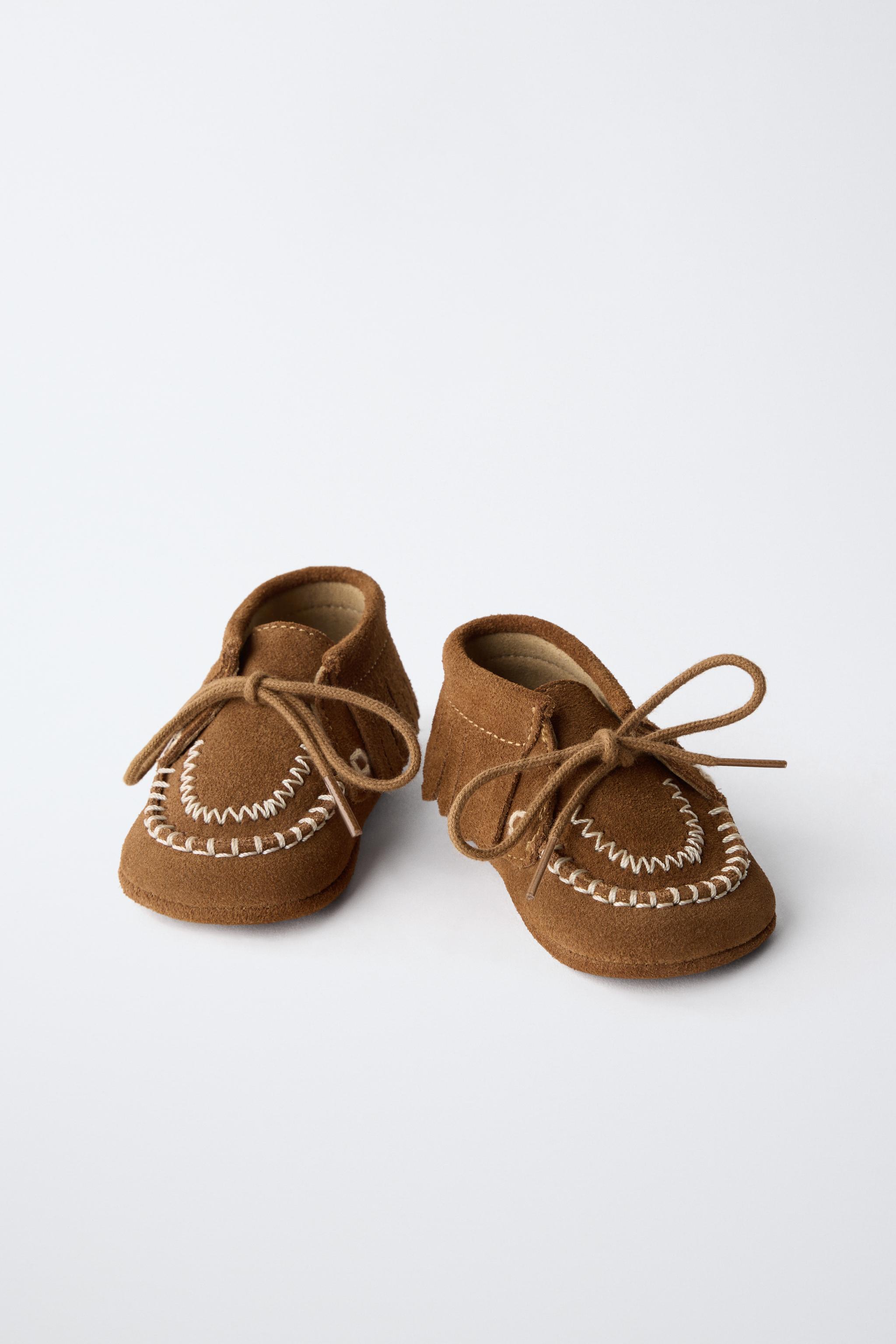 BOTTINES EN CUIR À FRANGES
