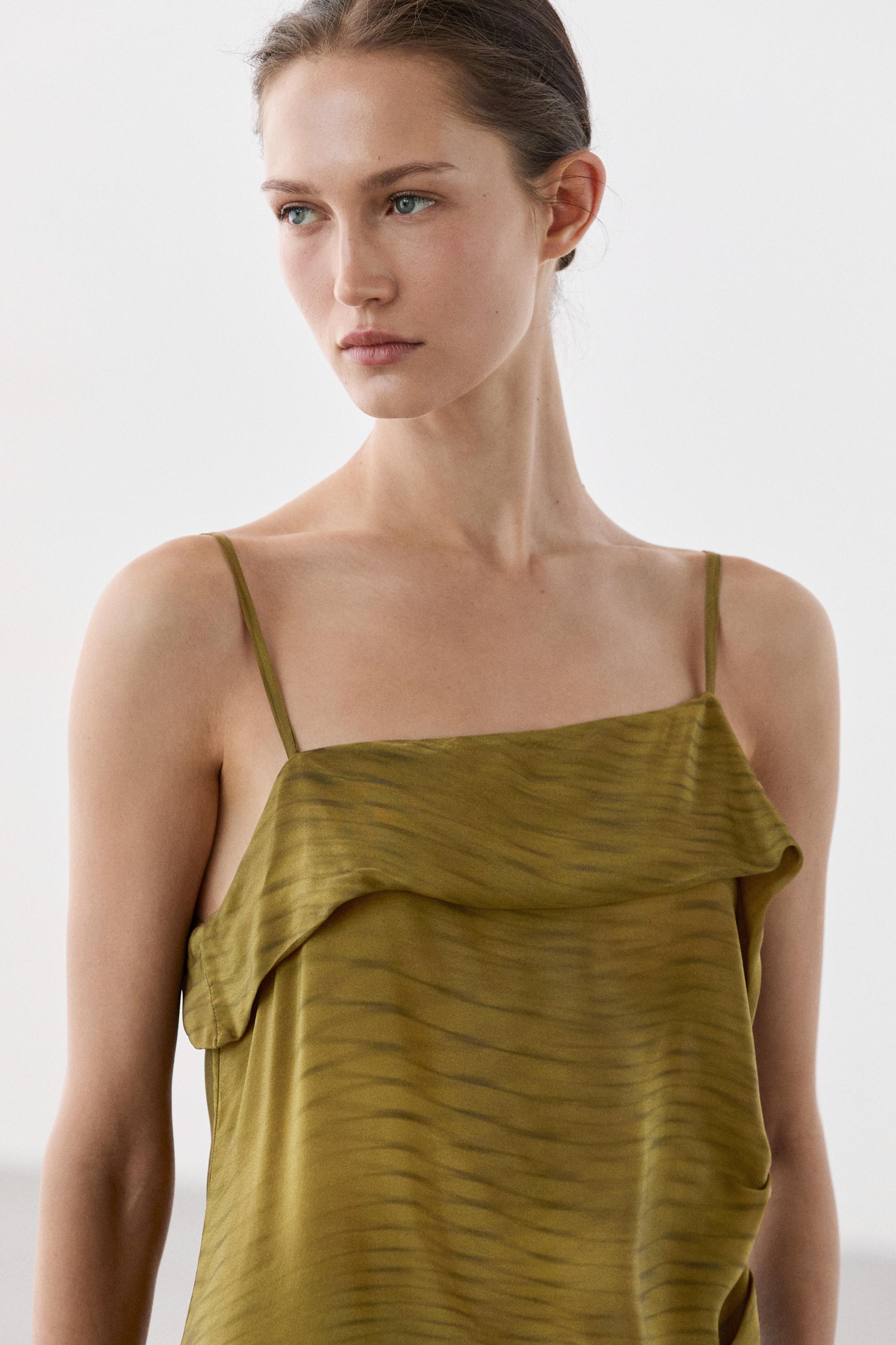 Asymmetric strappy top with draped detail