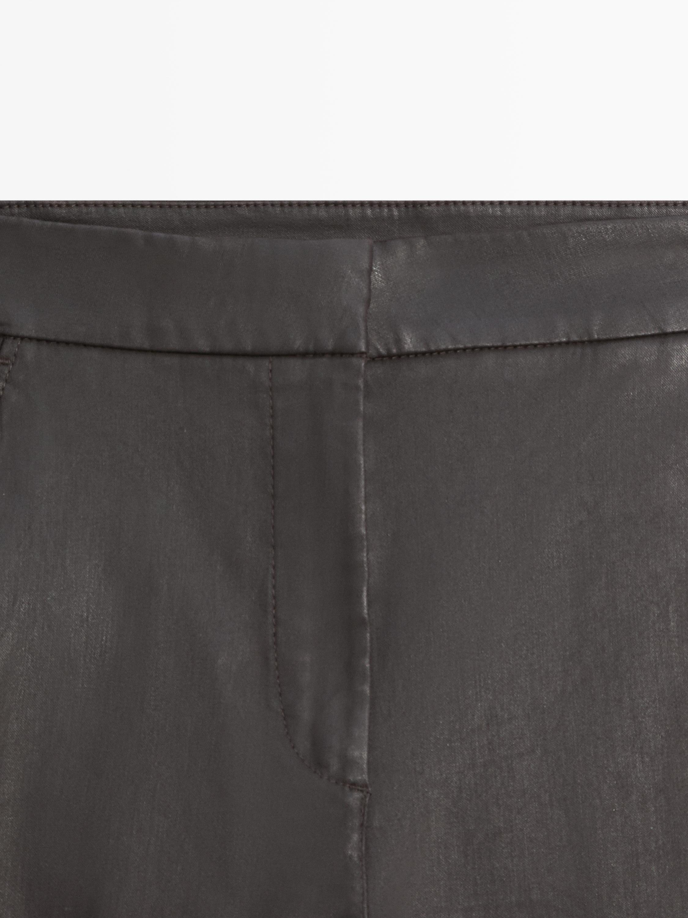 Waxed flare fit trousers