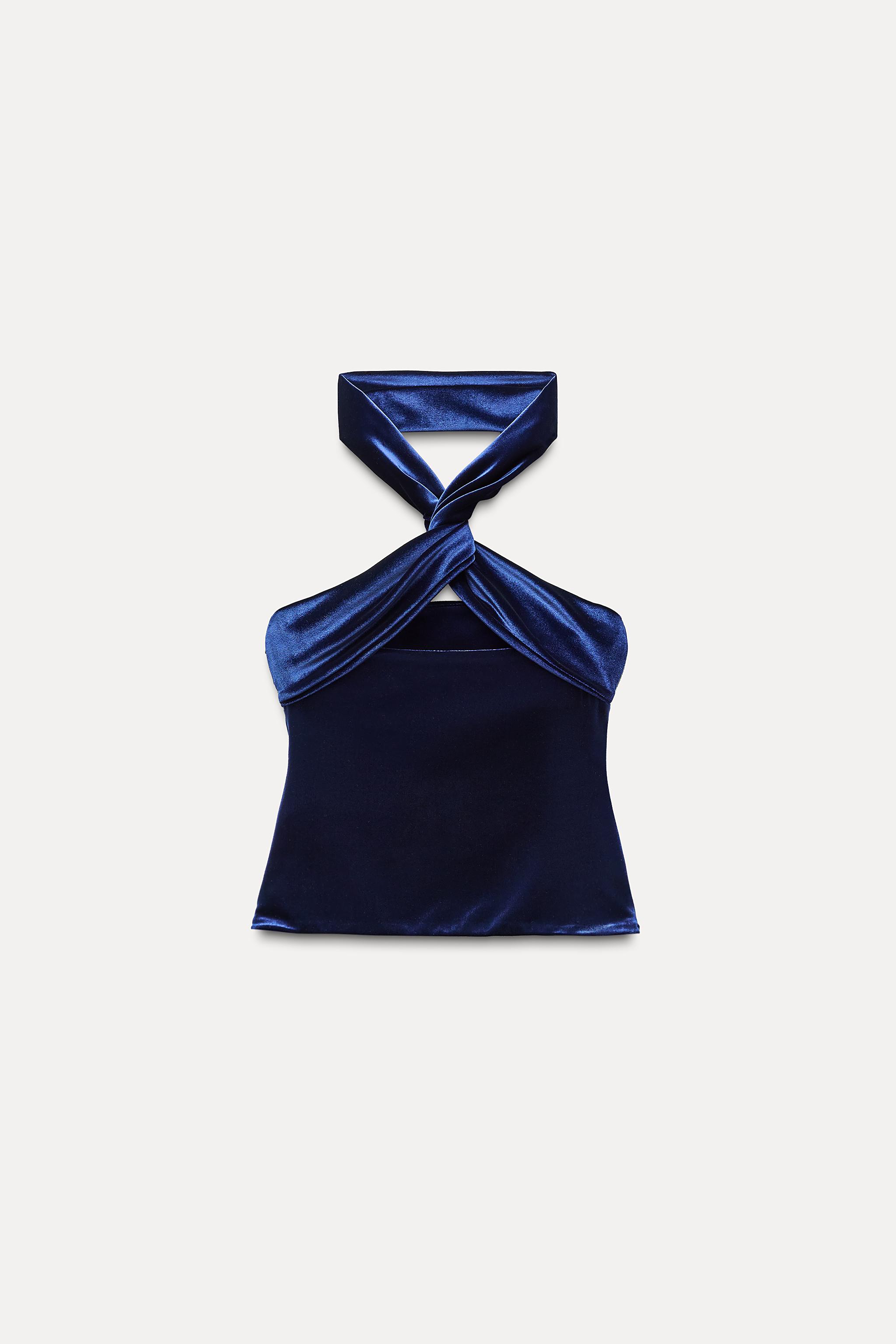 Straight neck top with straps that cross in back. Interior Straight neck top with straps that cross in back. Interior