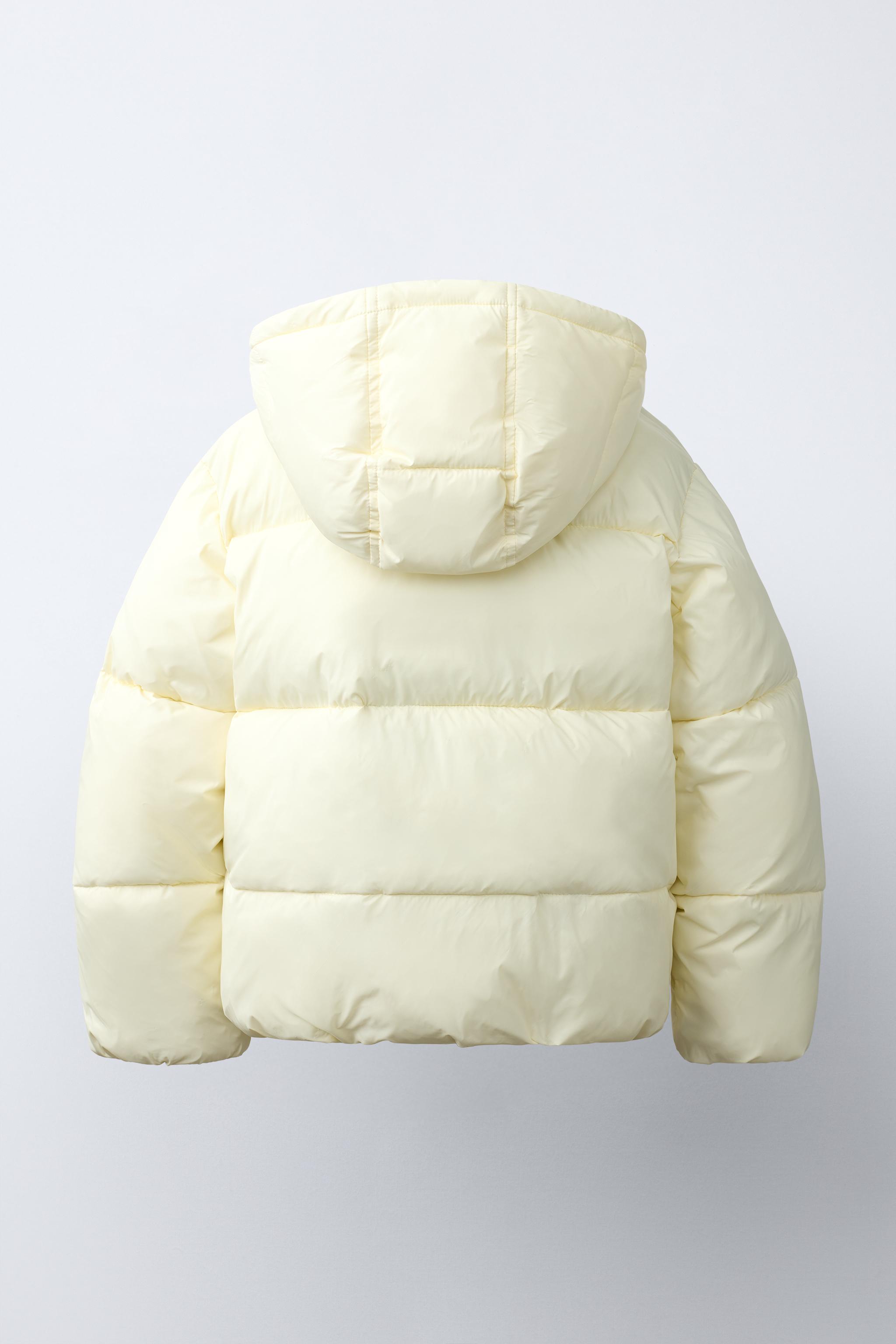 BLOUSON MATELASSÉ À CAPUCHE DÉPERLANT
