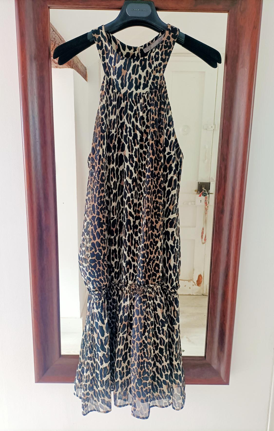 Front view of a dress with animal print and a relaxed fit.