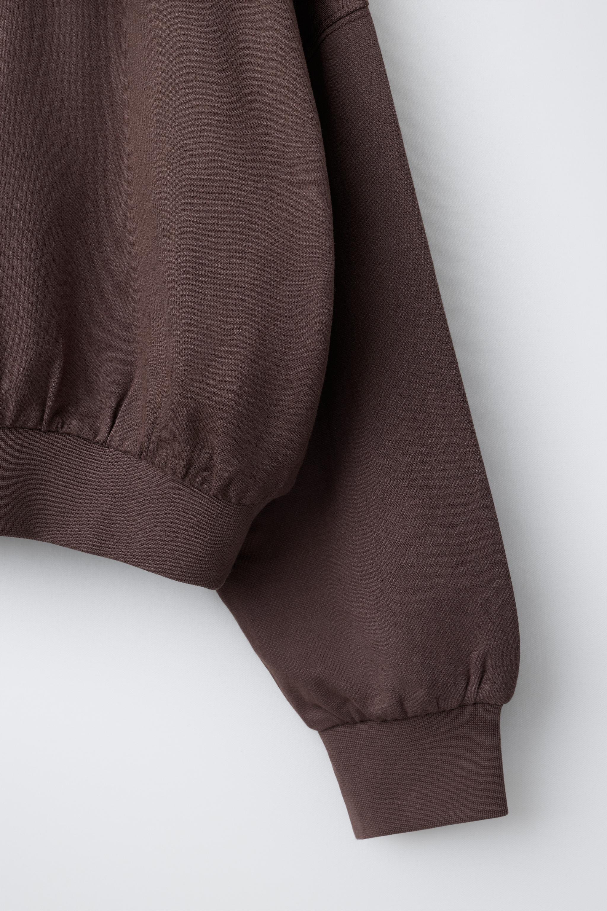RAISED TEXT HOODIE