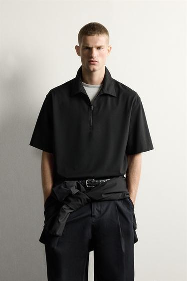 POLO TÈCNIC AMB CREMALLERA - Negre de Zara