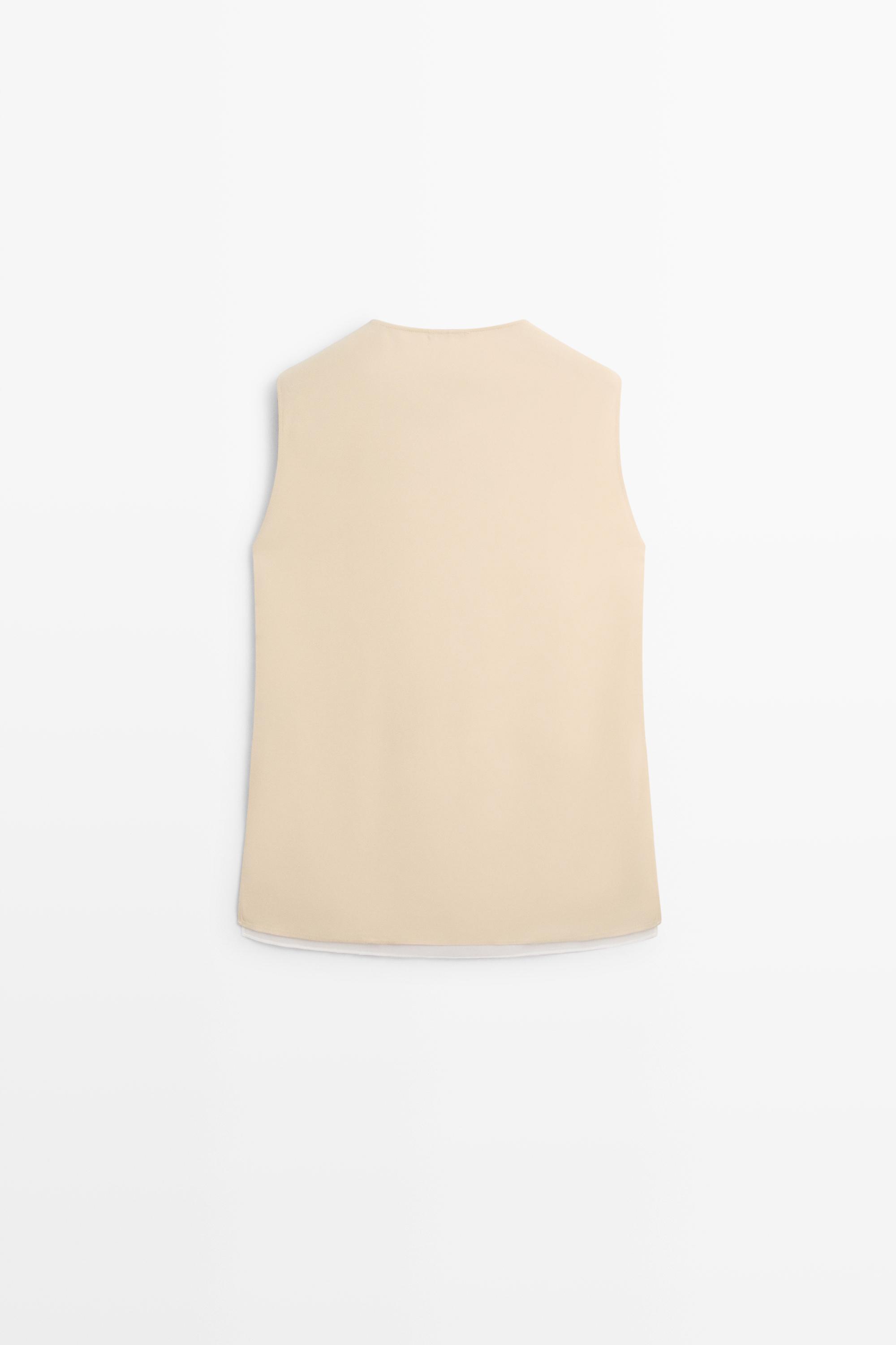 Flowing double-layer top with contrast detail