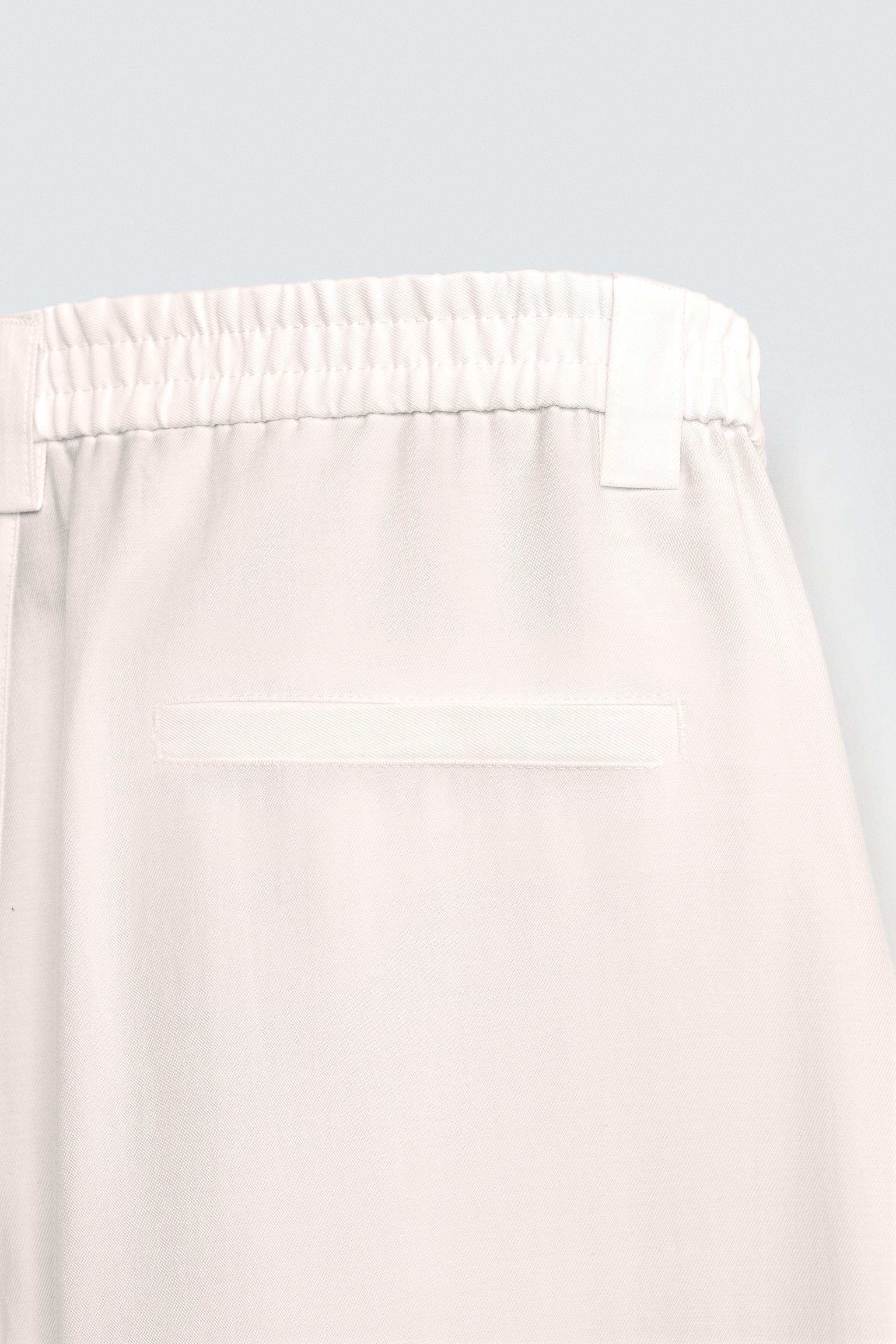 FLOWY PANTS WITH SIDE PLEATS