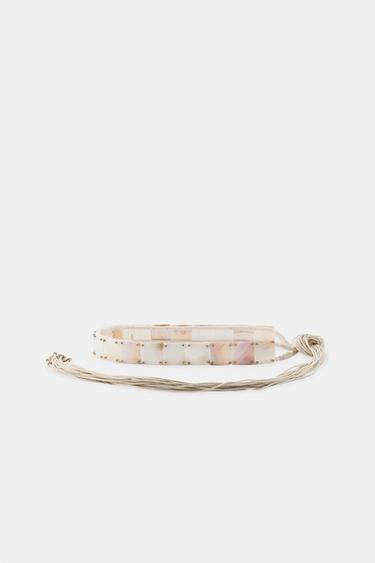 РЕМЕНЬ ИЗ ШНУРКОВ И РАКУШЕК — ЭКРЮ от Zara