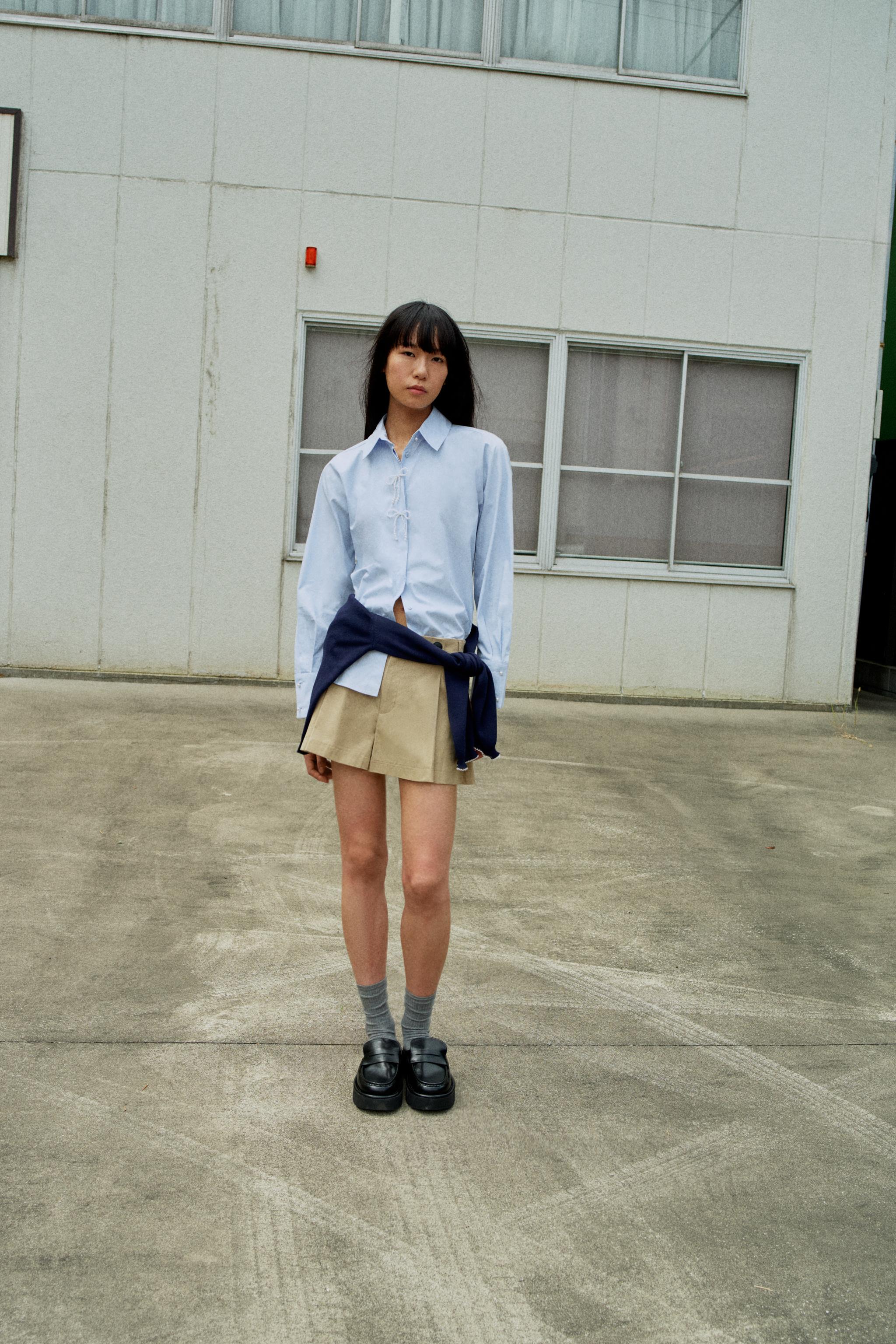 COURREGES PARIS リボン付きライトブルーシャツ COURREGES PARIS リボン付きライトブルーシャツ