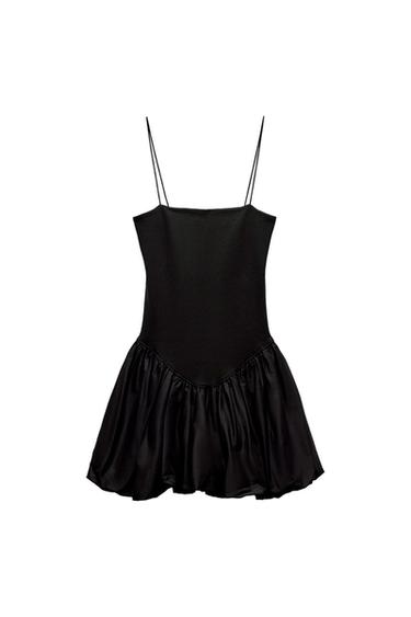Front view of a black dress with thin straps and a flared skirt.