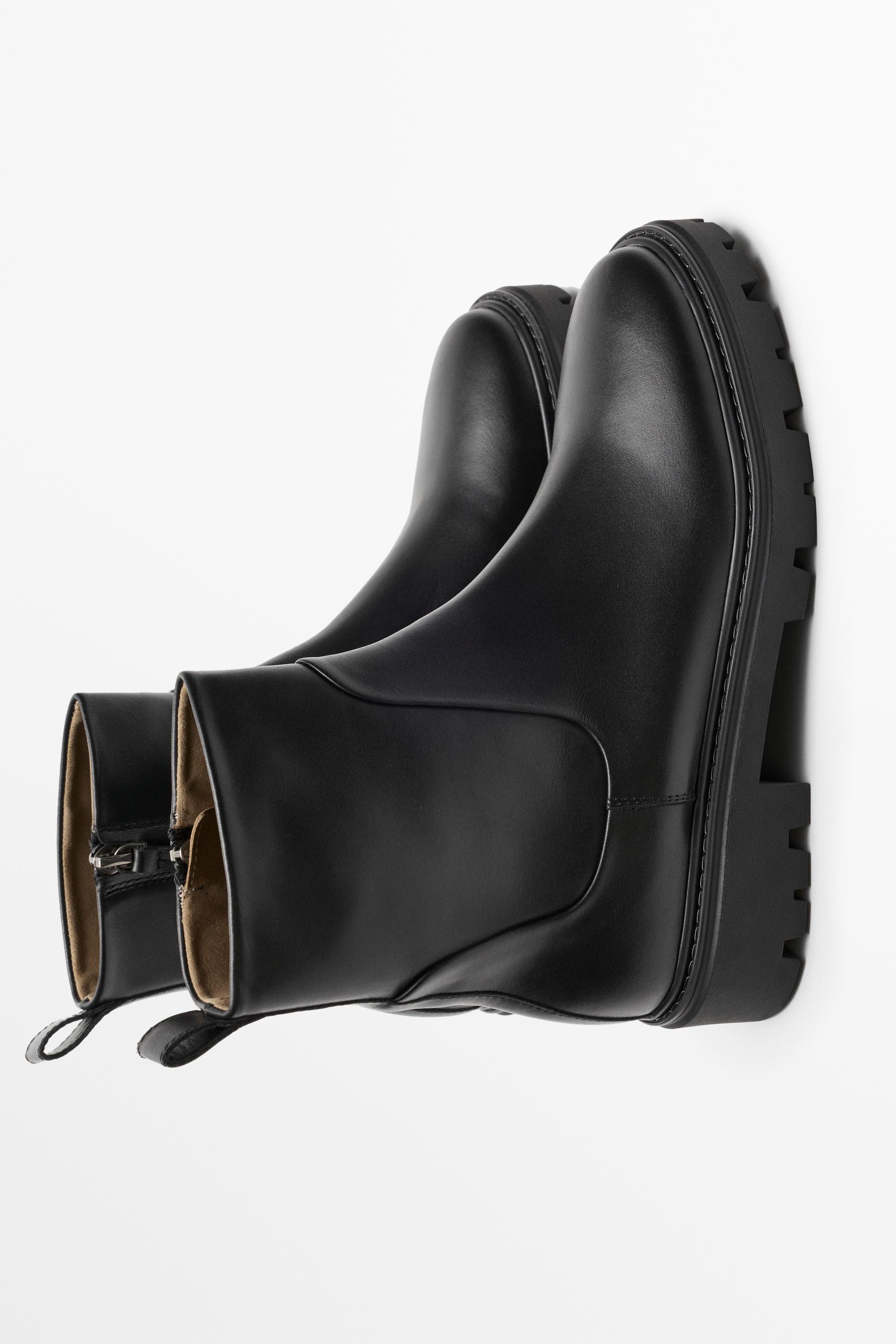 Flat leather ankle boot with track sole
