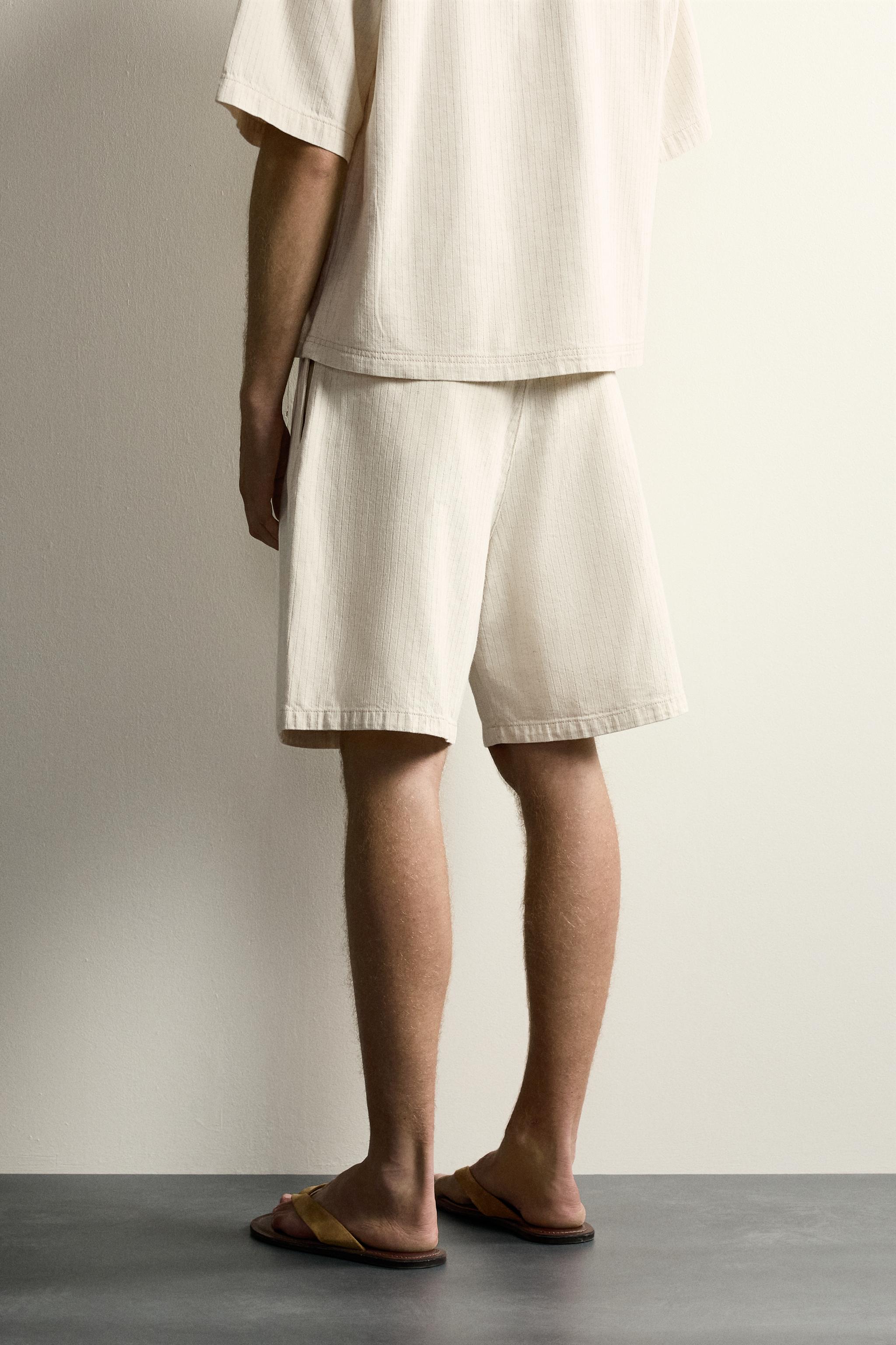 WIDE FIT STRIPED PLEATED SHORTS