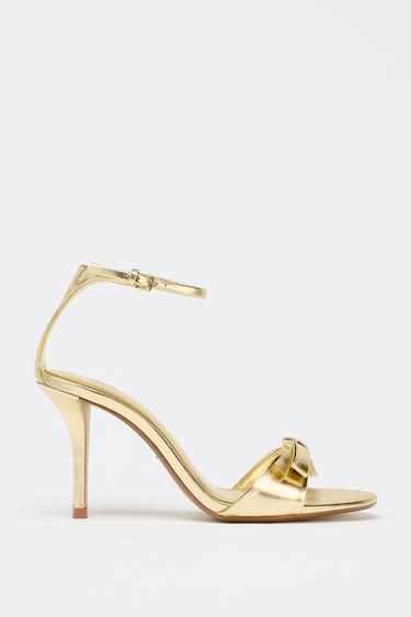 METALLIC-EFFECT BOW HEELED SANDALS - Gold by Zara - Image 0