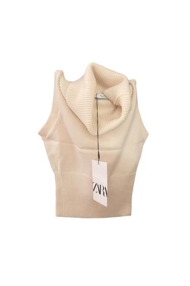 PULL SANS MANCHES COL ROULÉ ÉCRU