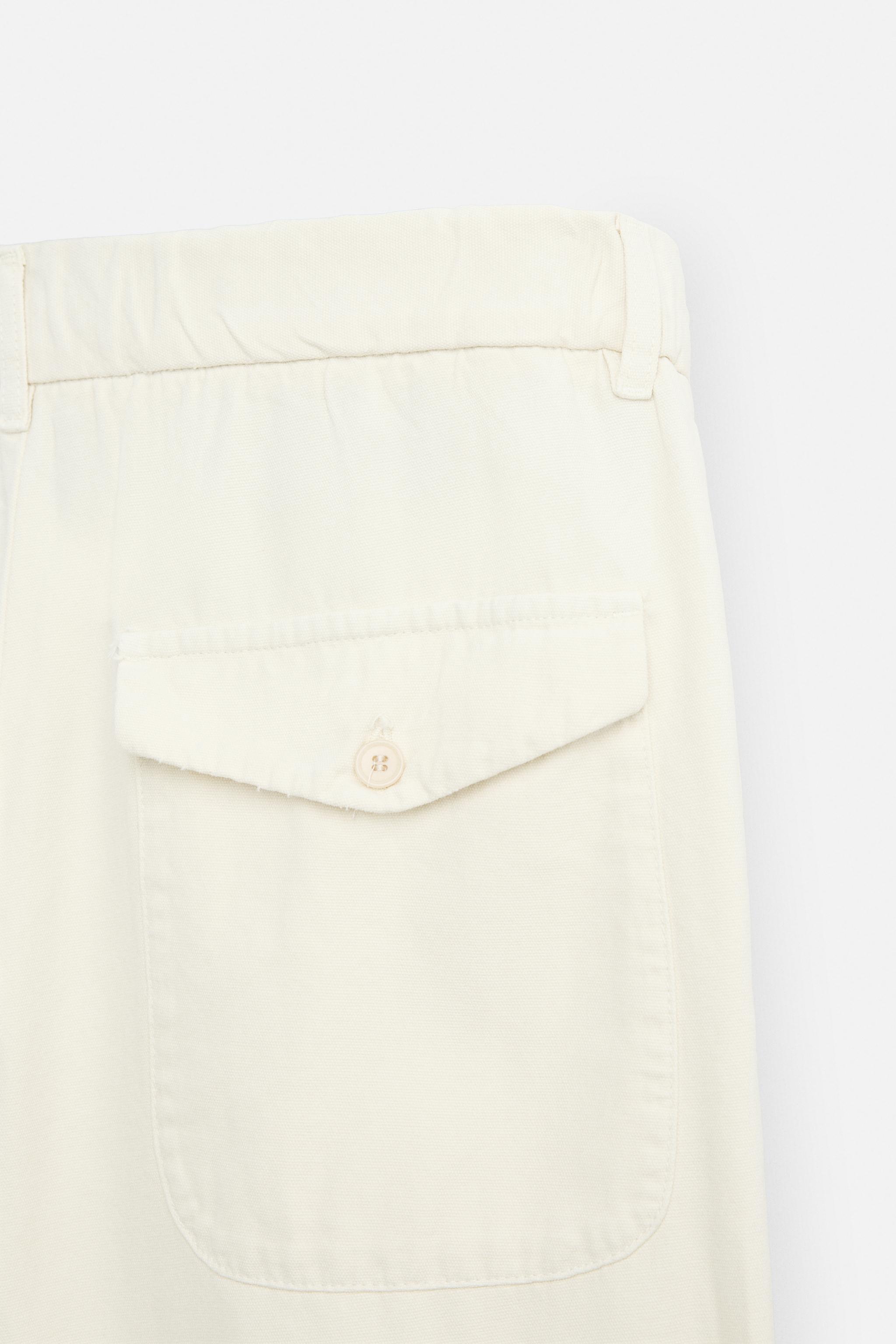 RELAXED FIT PLEATED PANTS
