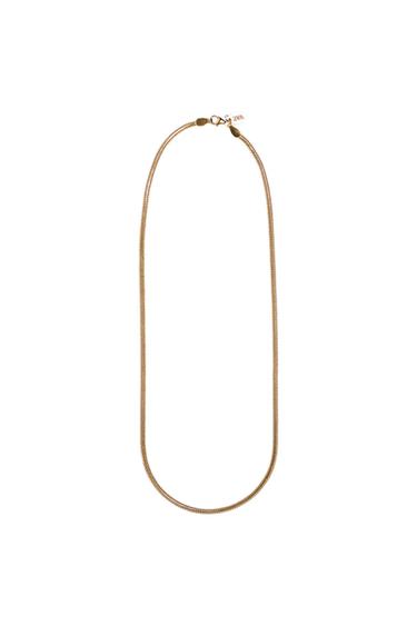 Thin gold chain with a lobster clasp and a "ZARA" text label on a white background.