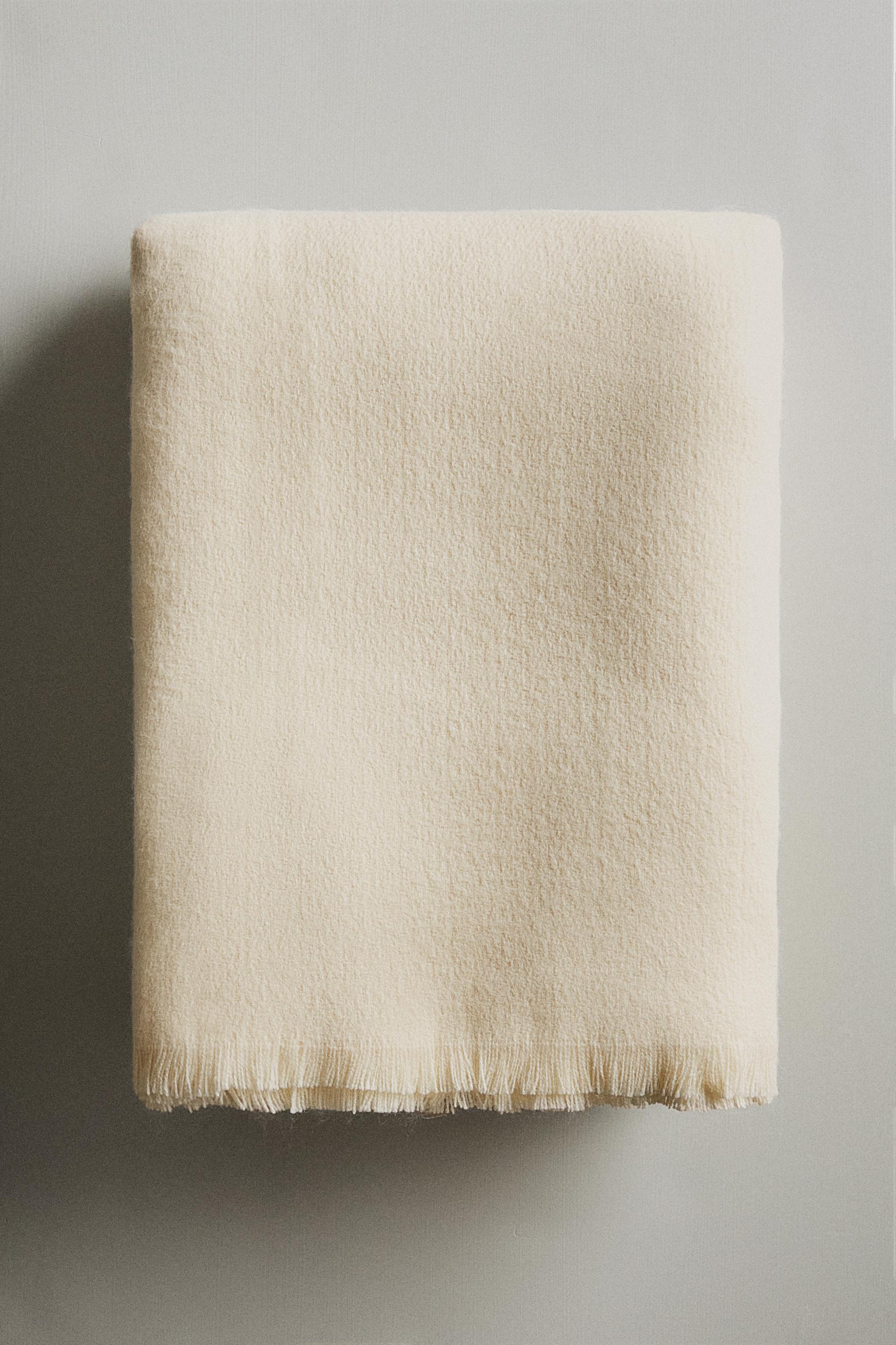 DECORATIVE FRINGED BLANKET
