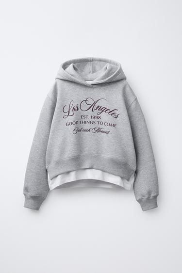 سويت شيرت VARSITY بغطاء رأس وحافة سفلية مزدوجة - رمادي فيجوريه الخاص بـ Zara