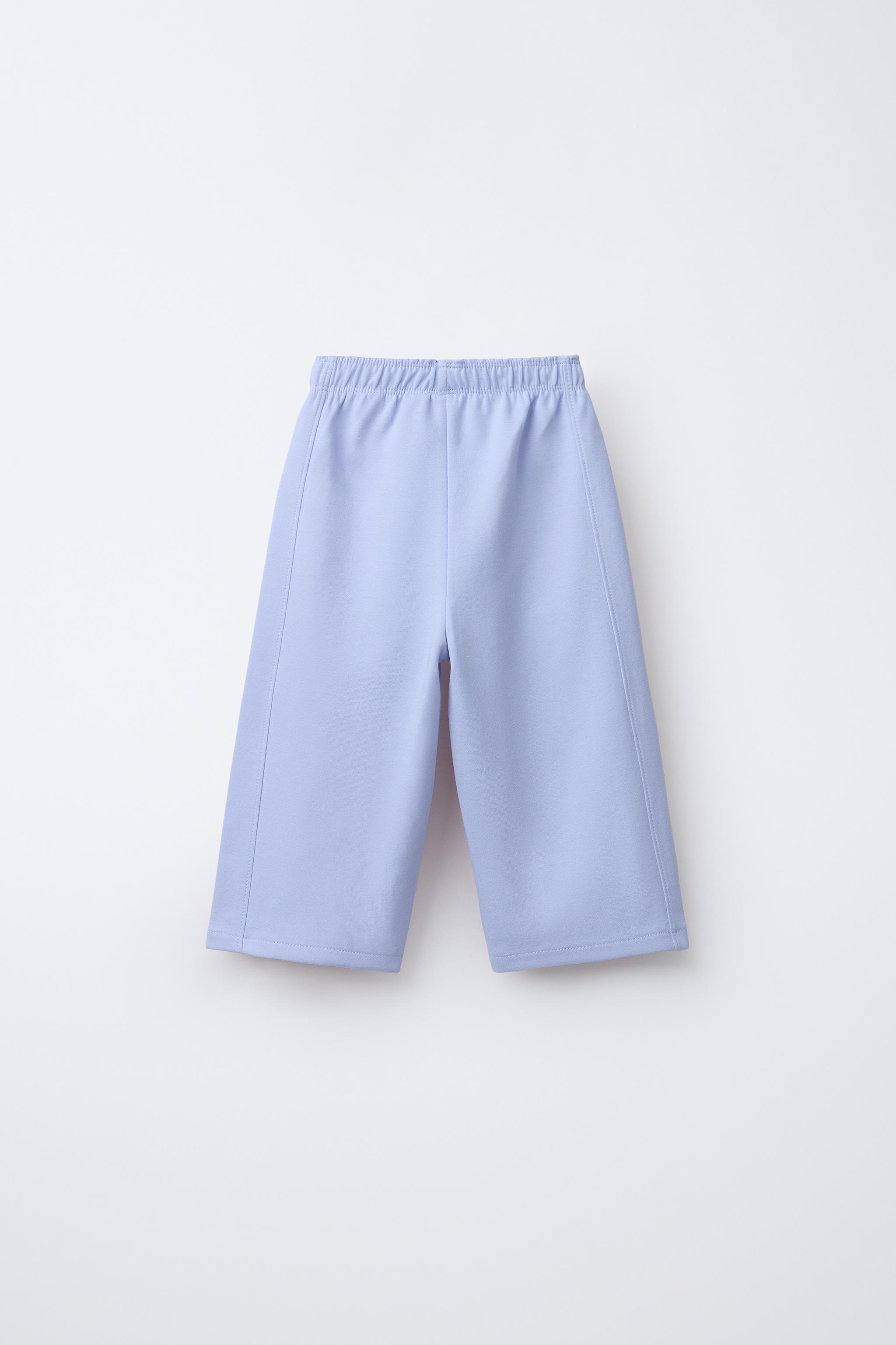 WIDE LEG INTERLOCK RAISED TEXT PANTS