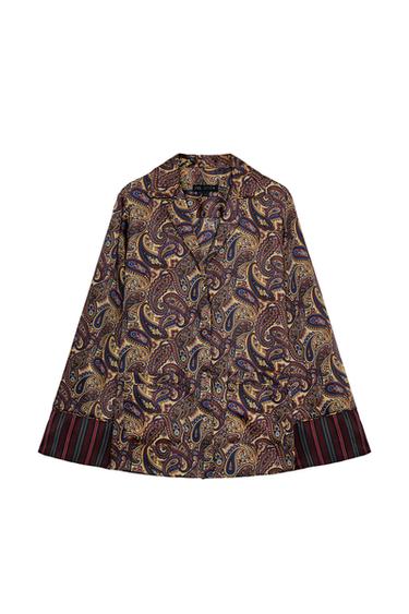 Front view of a multi-coloured shirt with paisley print, shirt collar, long wide sleeves and front button fastening.