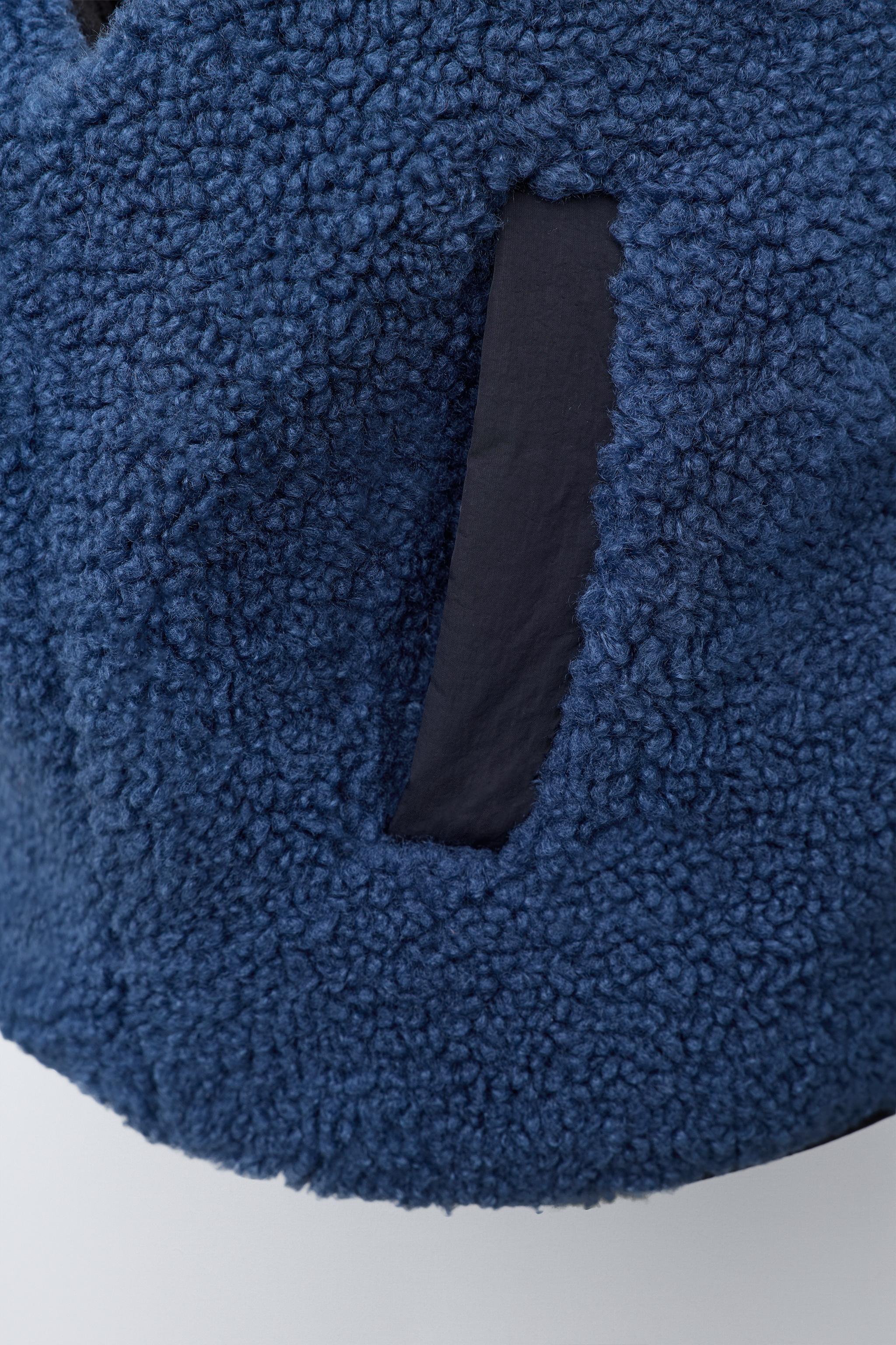 GILET EFFET MOUTON RETOURNÉ CONTRASTANT