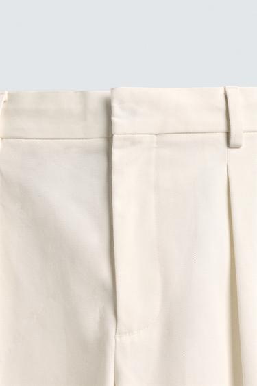 PANTALON CHINO À PLIS AARON LEVINE X ZARA - Blanc cassé de Zara - Image 7