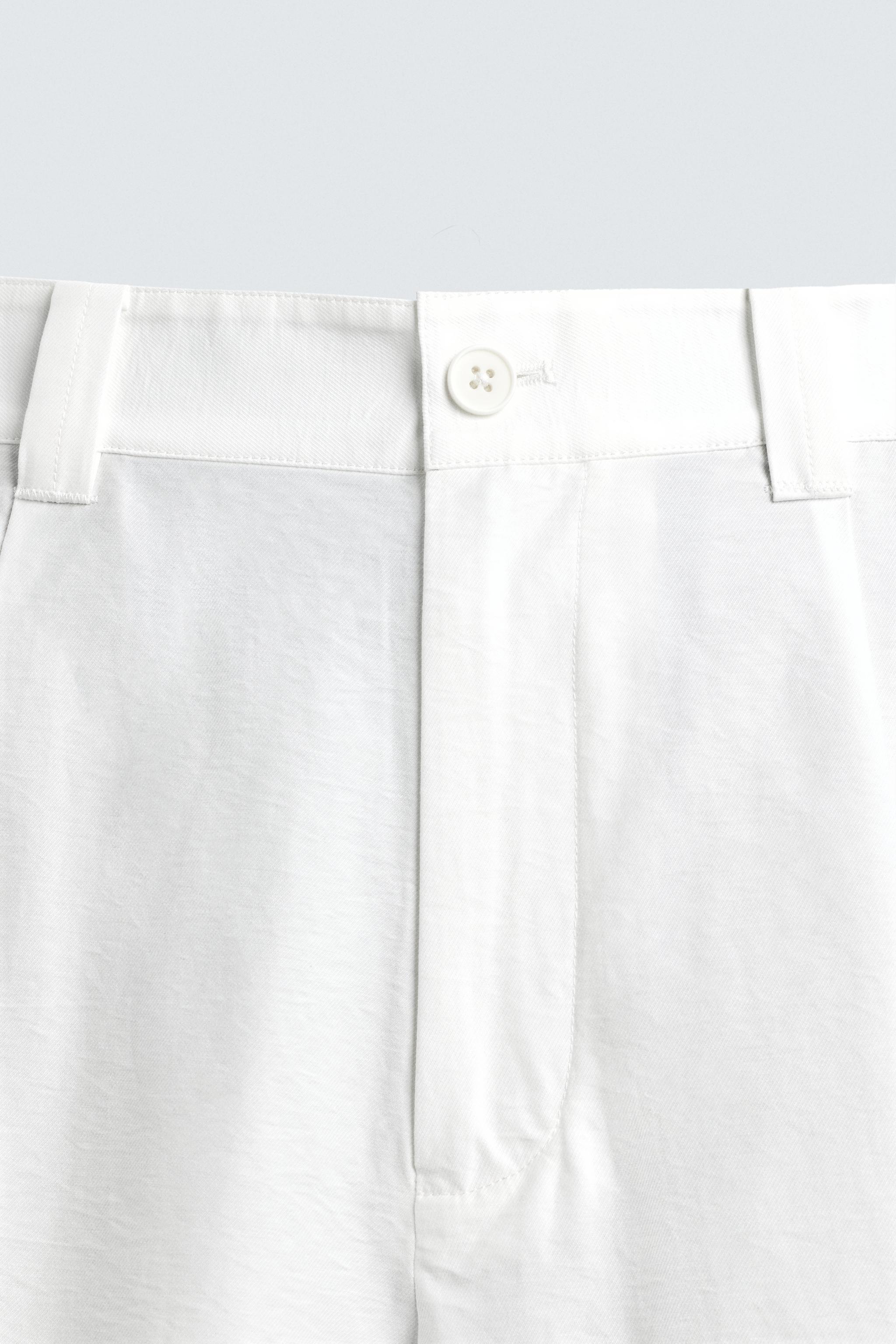 PANTALON COUPE LARGE À PLIS