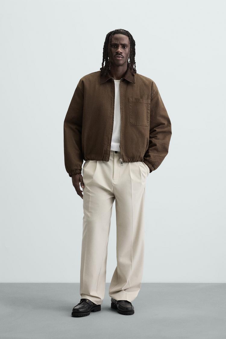 WIDE FIT PLEATED TROUSERS