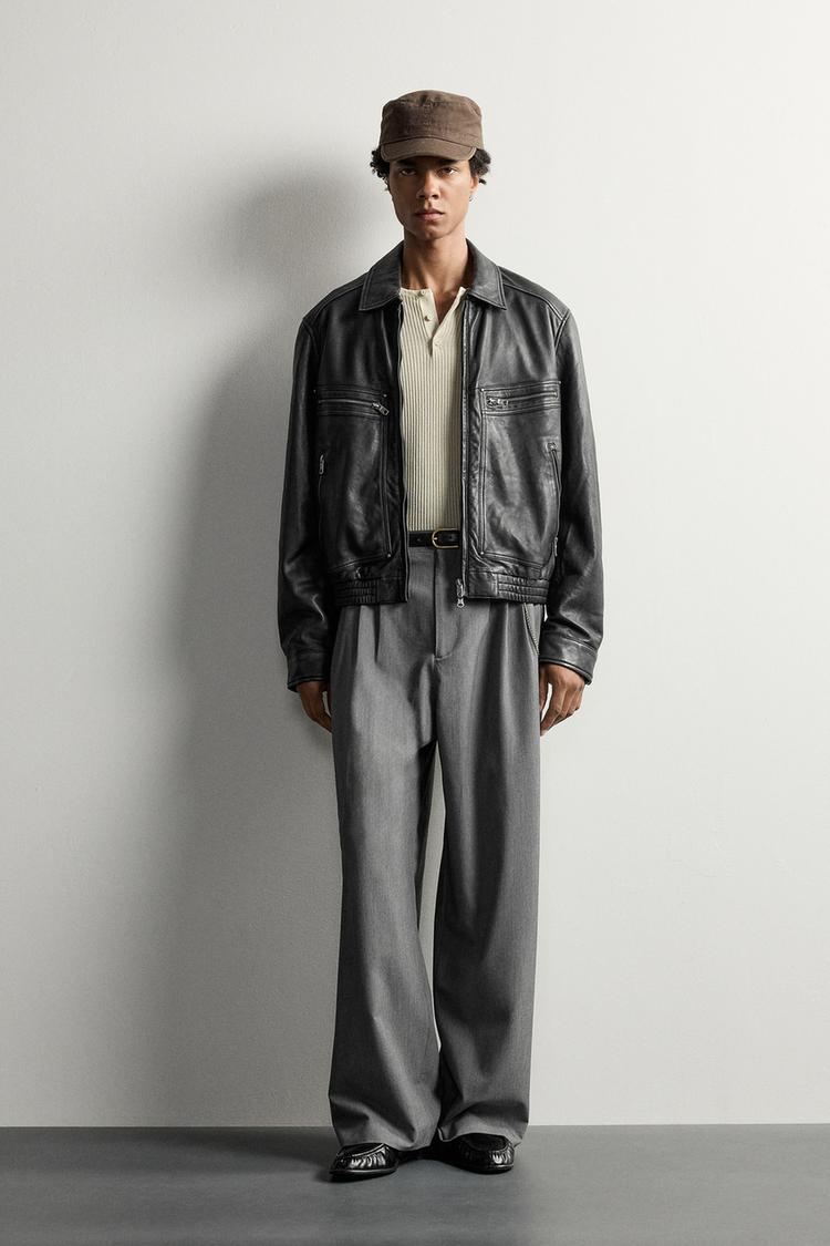 WIDE-LEG PLEATED TROUSERS