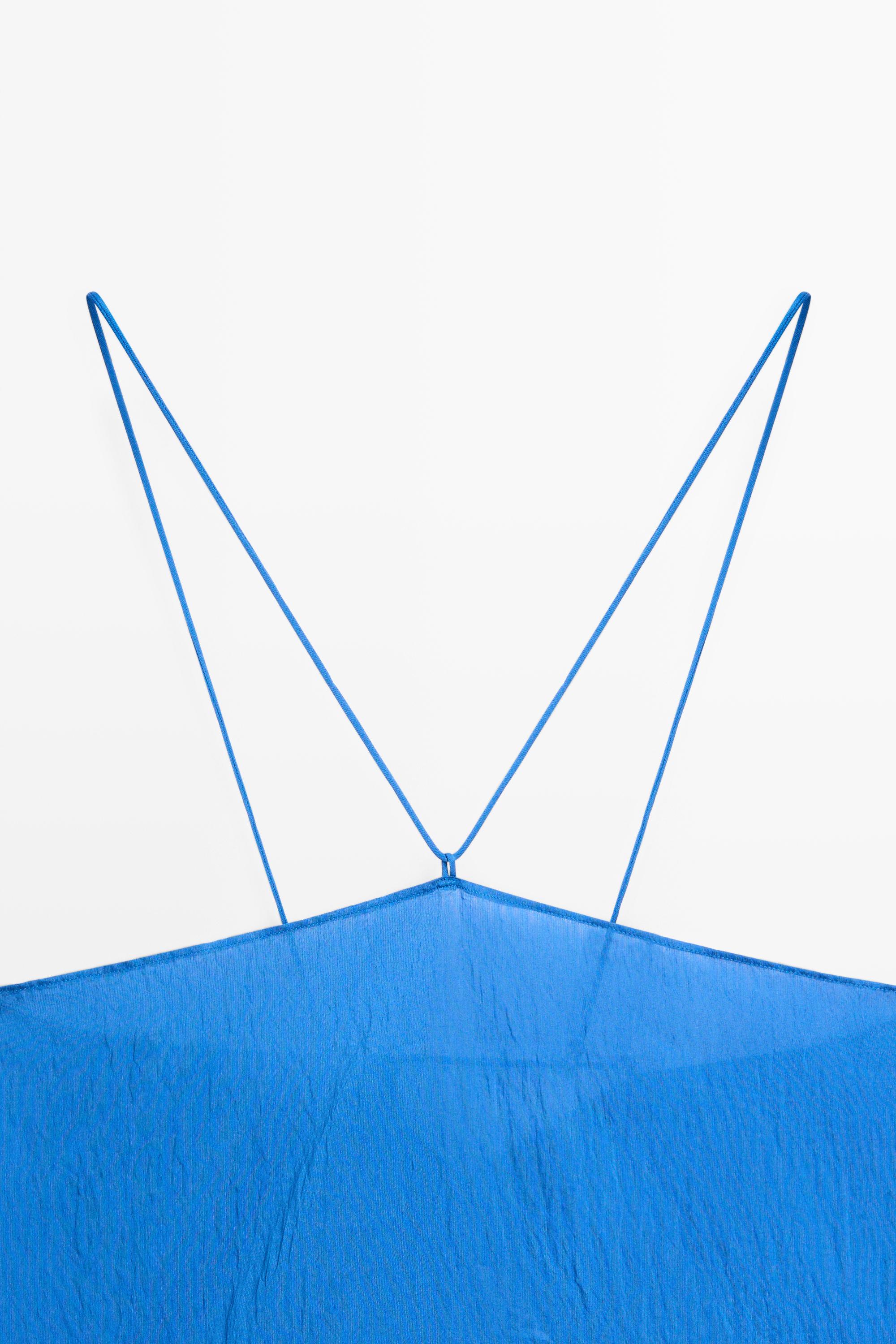 Flowing halter top with tie detail
