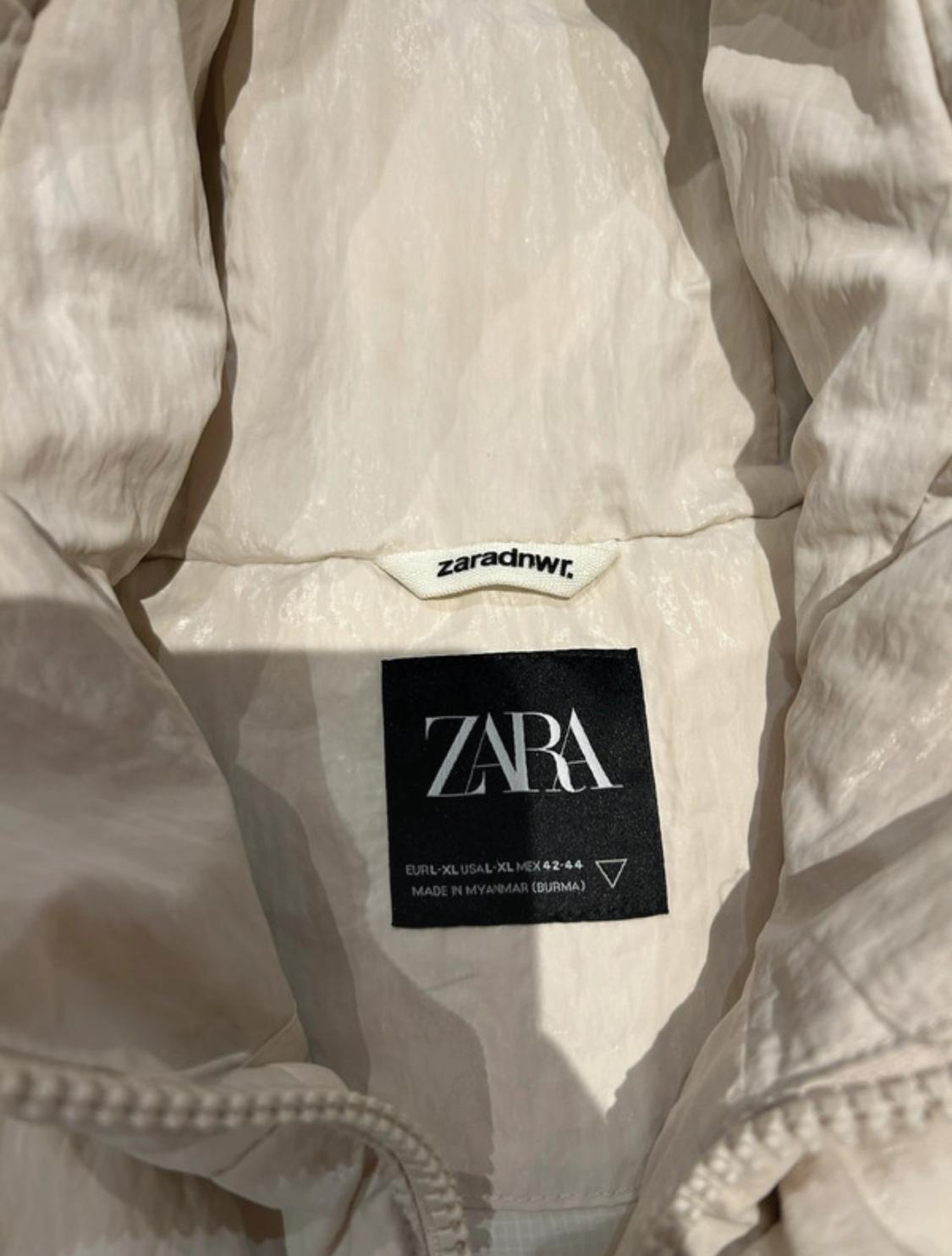 Inside label of a white garment with the ZARA logo. Text: "EUR-XL USA-XL MEX 42-44 MADE IN MYANMAR (BURMA)".