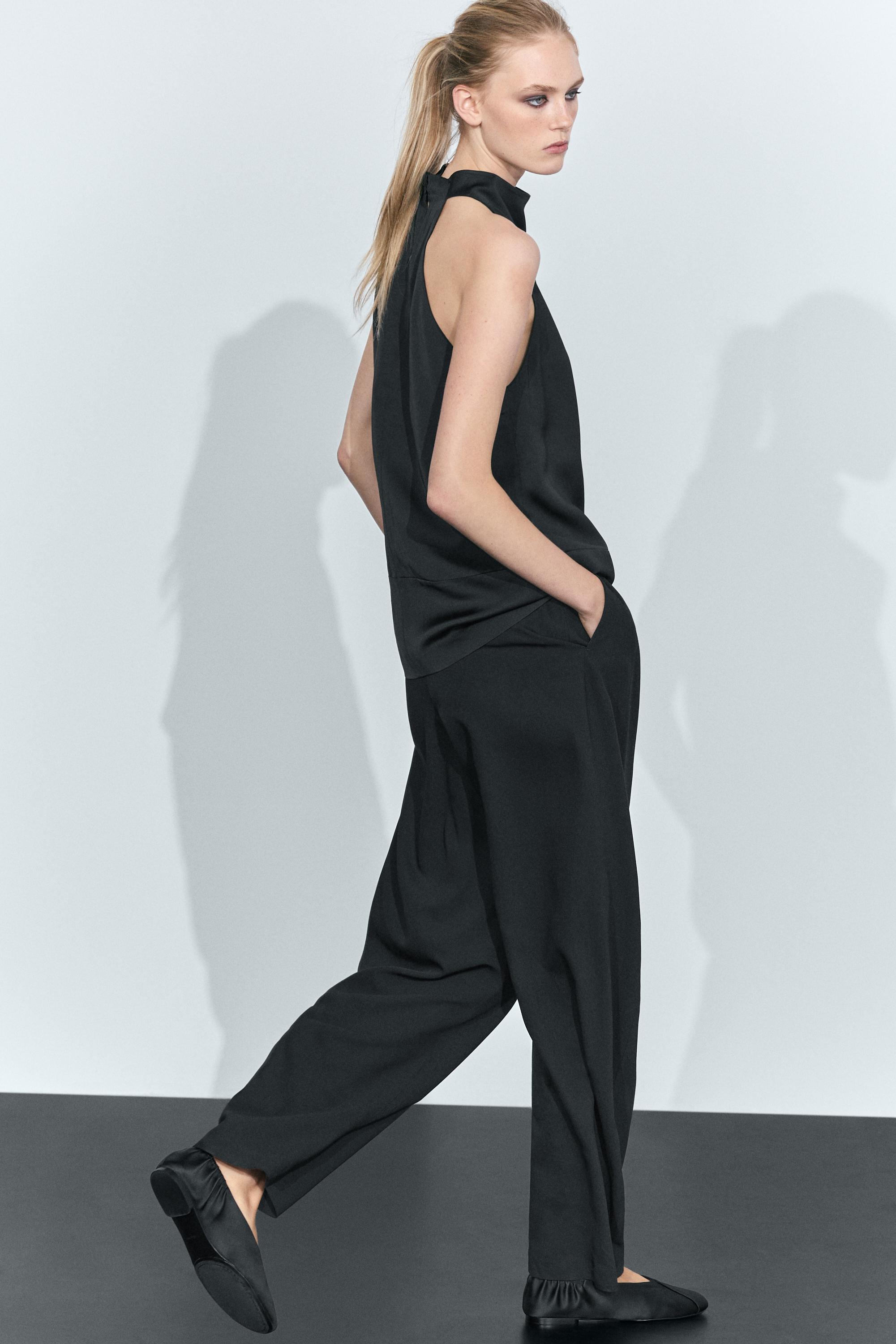Flowing halter neck top with waistband effect