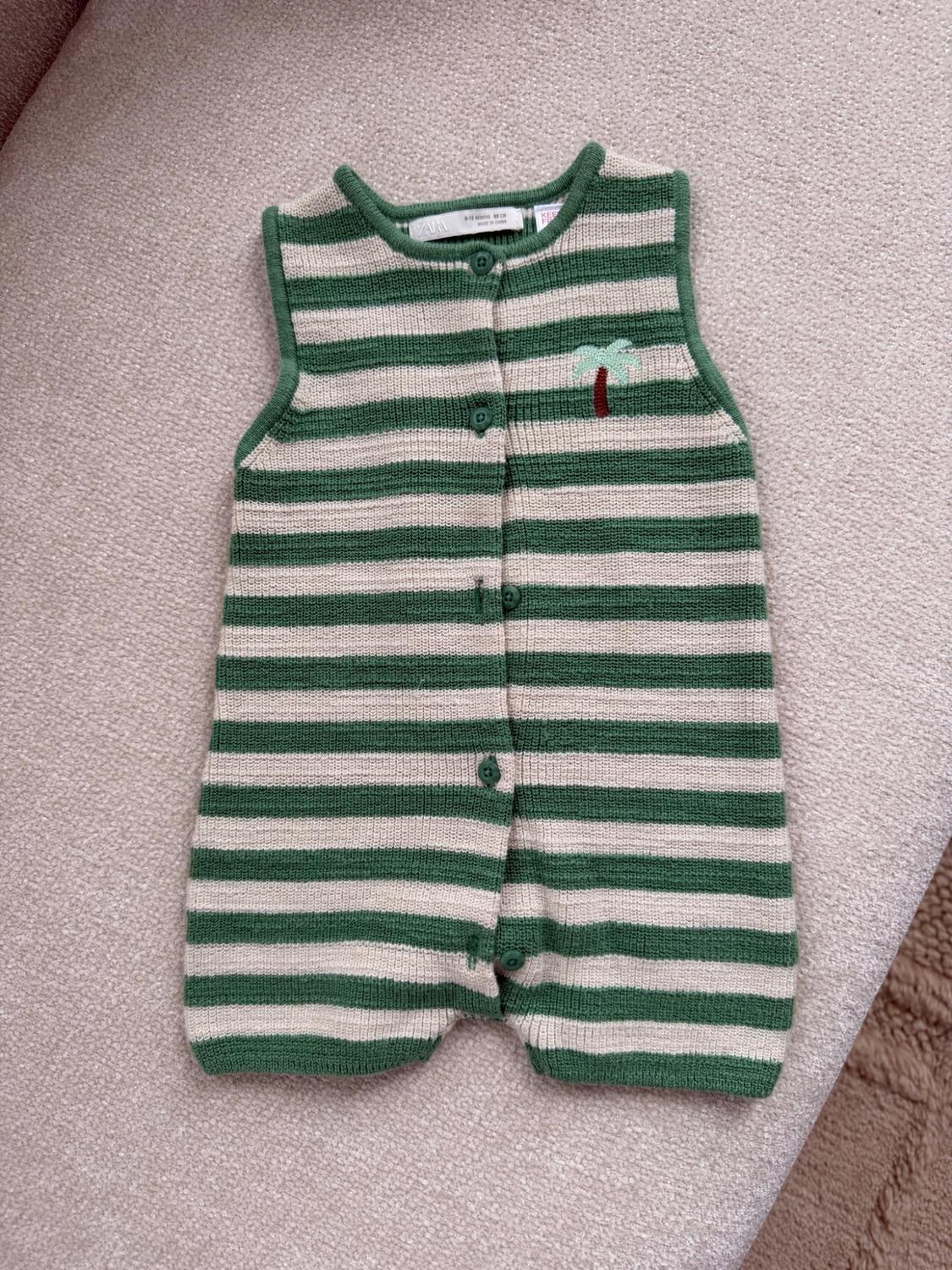 Striped green and beige knit baby jumper, sleeveless, with front buttons and a small palm tree embroidery on the chest. Brand Zara.