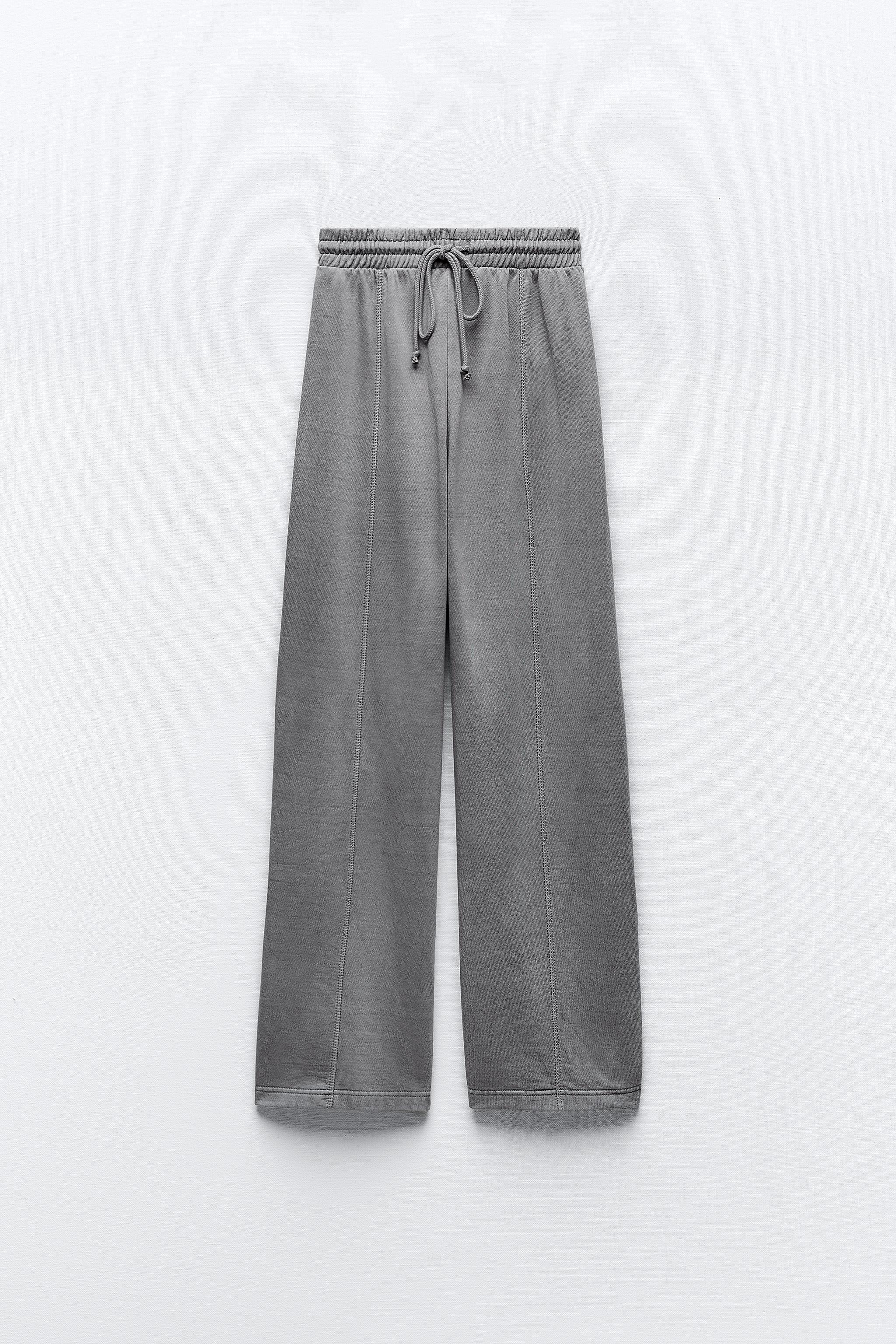 Pants with a high waist with adjustable elastic drawstring waistband.  Straight leg and pronounced seams. - Gray marl